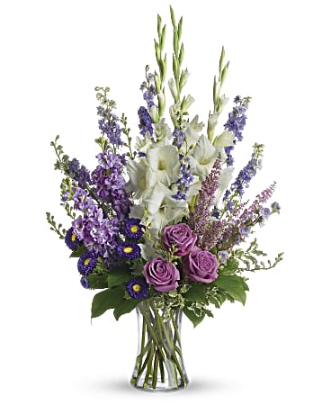 Joyful Memory Bouquet  - Lavender and white sympathy flowers make a grand statement in this joyful bouquet. Cherish your memories with this lasting remembrance of lavender larkspur and roses, deep purple asters, pure white gladioli and the softest pink heather. A classic assortment of flowers such as lavender larkspur, stock and roses, plus purple asters, white gladioli and pink heather.
