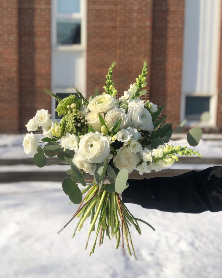 White bouquet with round blooms and green accents