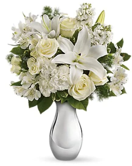 Shimmering White Bouquet - All is calm, all is white in this exquisite bouquet featuring white roses, lilies, alstroemeria and stock in a sparkling silver reflections vase. What a beautiful gift during this beautiful season. They'll be thrilled. The gorgeous bouquet includes white roses, white spray roses, white oriental lilies, white alstroemeria and white stock accented with assorted greenery.   Orientation : All-Around  All prices in USD ($)  Standard  T407-1A  Deluxe  T407-1B  Premium  T407-1C  "