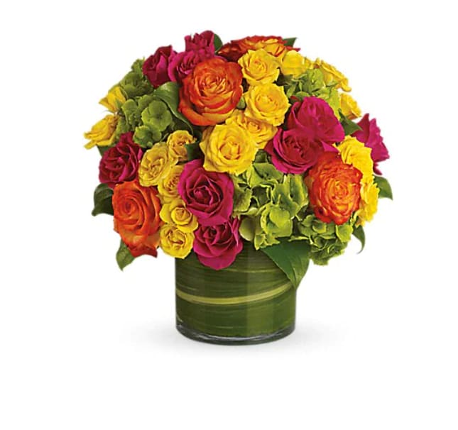 Colorful rose bouquet in a green glass vase