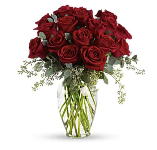 Bouquet of red roses in a clear glass vase