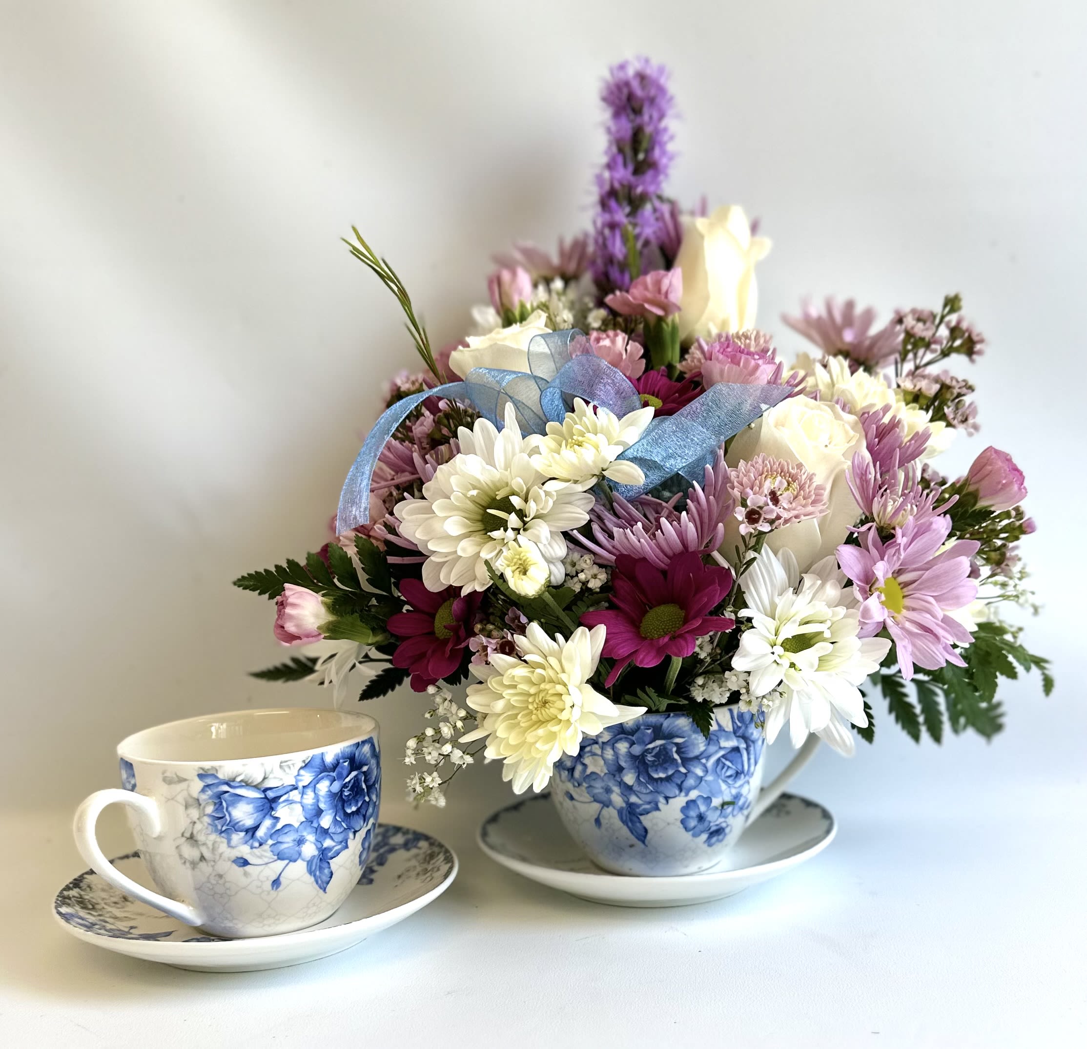 Blue England Rose by Barb’s Flowers - Teacup with a Blue English Rose design filled with a nice mix of flowers. 