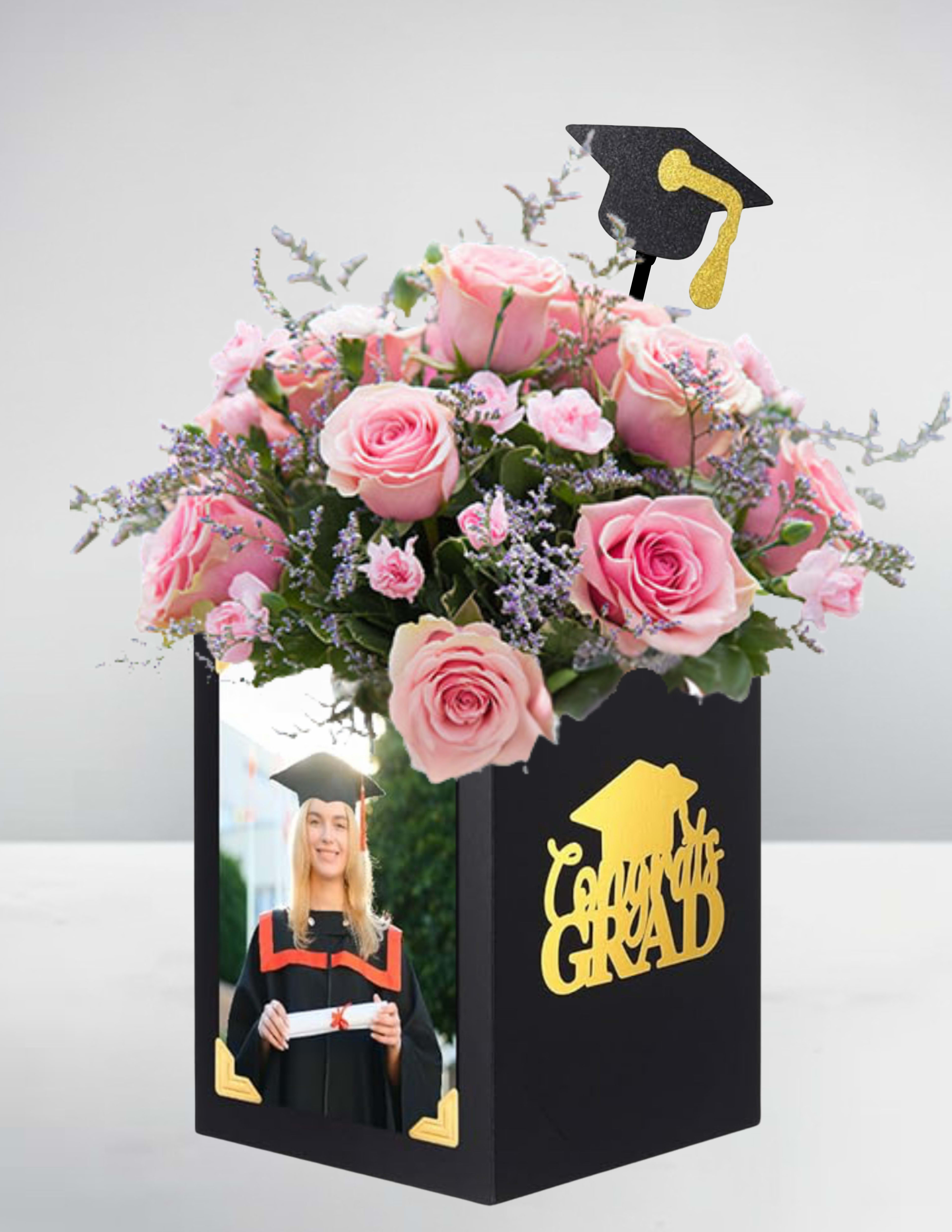 Graduation Celebration Box – Soft Rose Elegance - Graduation Celebration Box – Soft Rose Elegance You can email your photo to us or put it in yourself if emailing please email it to stargazing8882024@outlook.com with your order number after ordering.  Mark this special achievement with a graceful and feminine touch. Our Soft Rose Elegance Graduation Box showcases a beautiful arrangement of light pink roses and spray roses, symbolizing admiration, gratitude, and joy. Delicately arranged in a stylish keepsake box, this design also features a personal photo of the graduate, making it a truly meaningful and memorable gift. Perfect for adding a soft, elegant flourish to any graduation celebration.