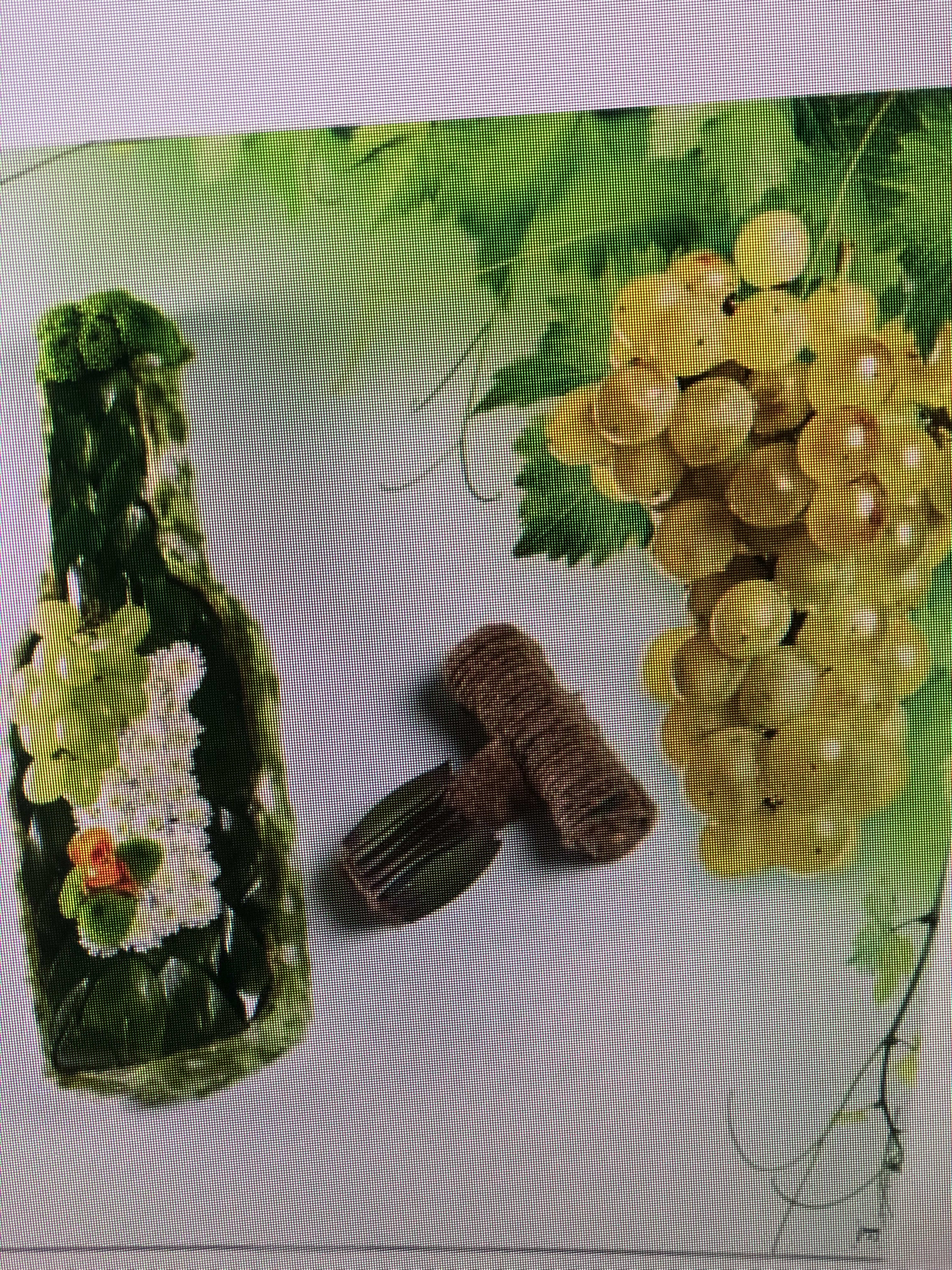 Two floral garlands with yellow and white blossoms and a small brown comb-like accessory