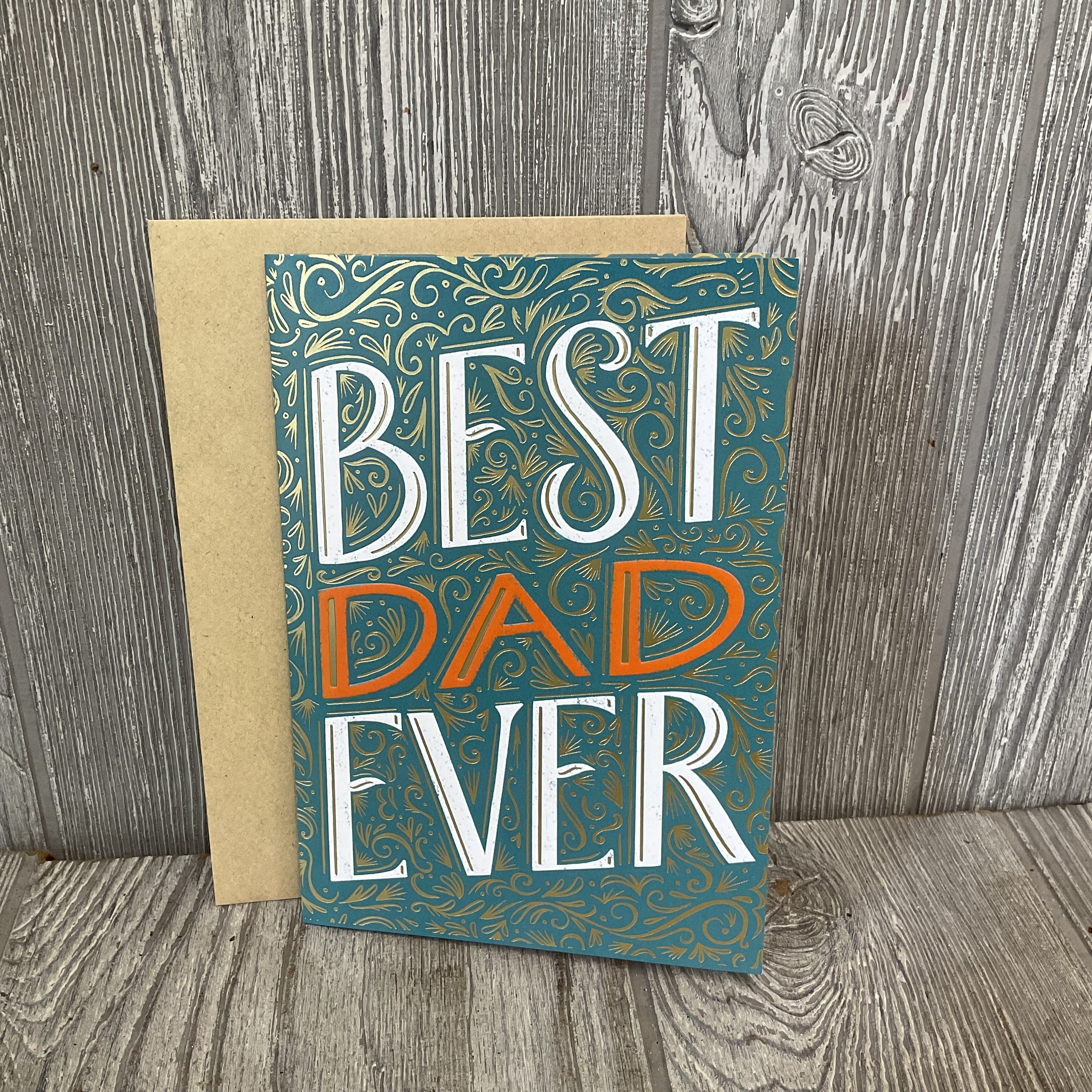 Greeting card reading "BEST DAD EVER" on a kraft envelope
