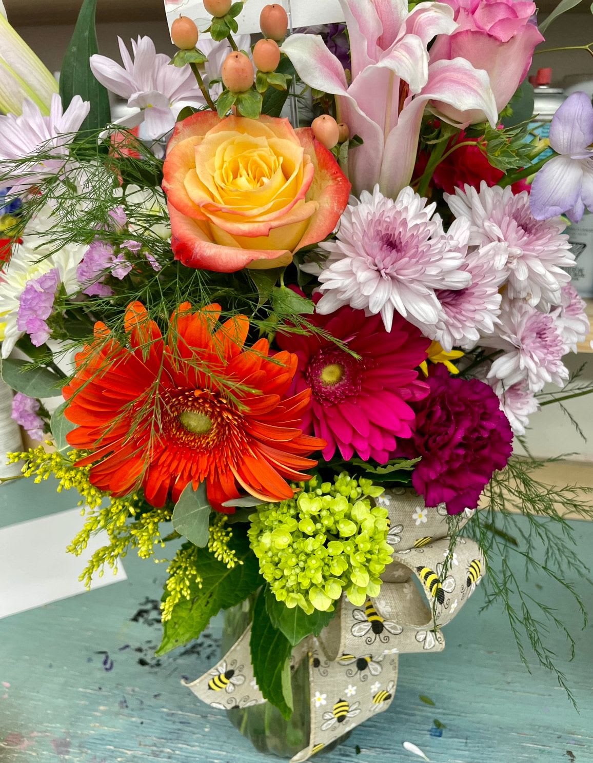 Time To Celebrate by Lotherington's - No matter what you're celebrating, this is a perfect gift to wish someone praise or honor their new beginnings. This arrangement contains Pink Gerbera Daisies, Roses, lilies, and Hydrangea. APPROXIMATE DIMENSIONS: 12"H x 11"D  ***Colors and blooms maybe substituted depending on season and availability ***