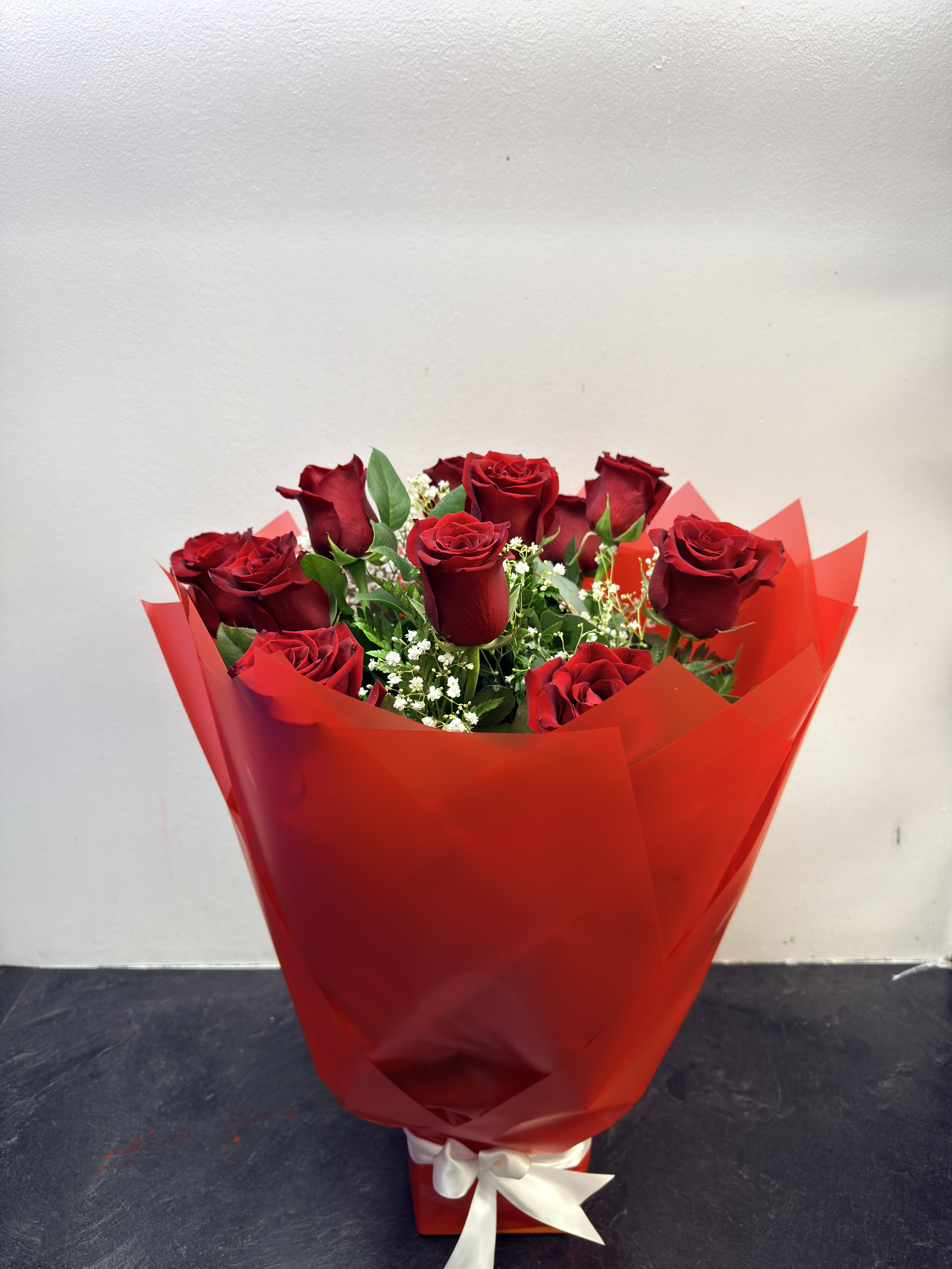 1 Dozen red roses arrangement  - this arrangement is made with fresh roses and wrapped up nice. 