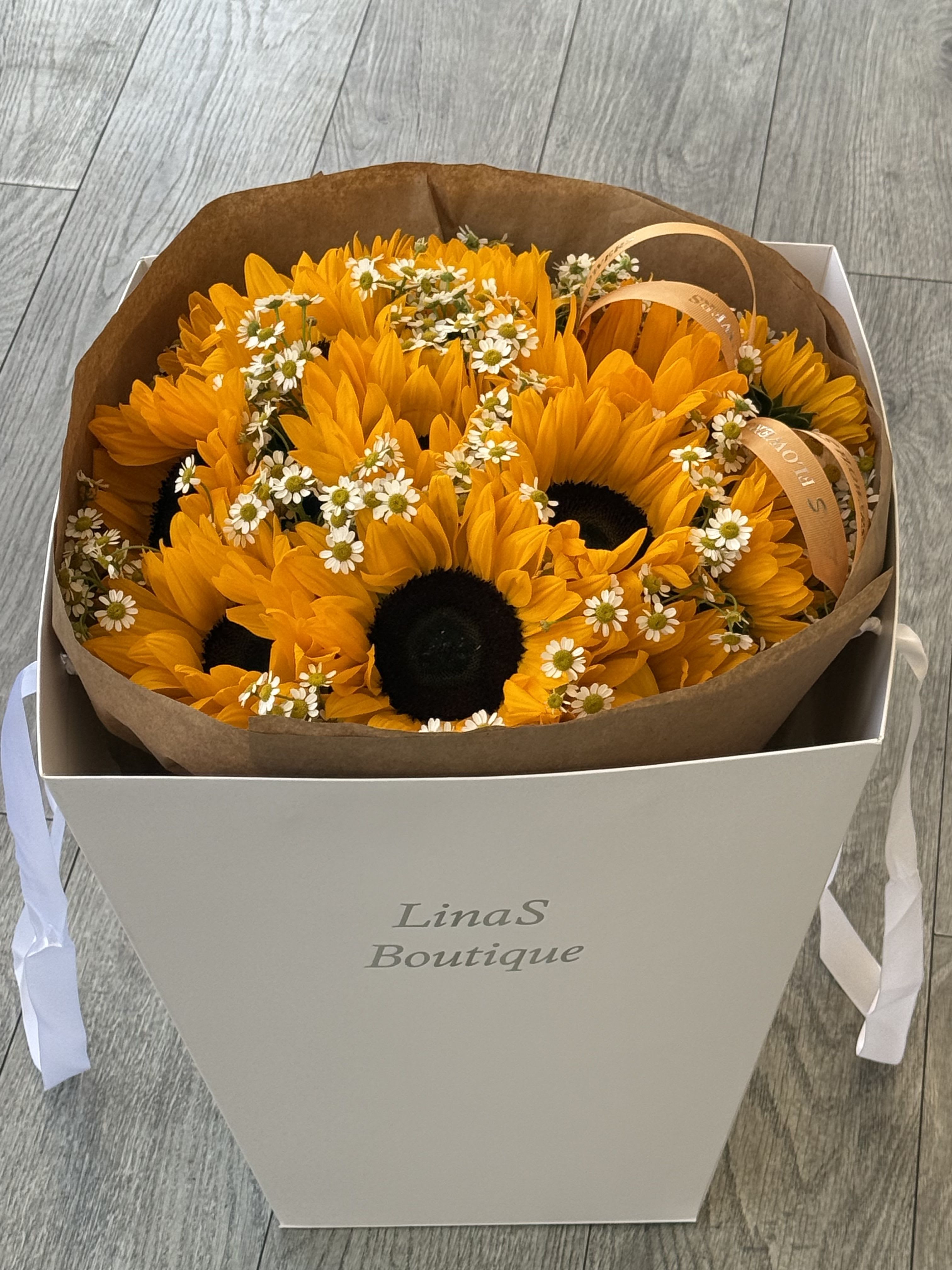 Lizi - Bright and cheerful sunflowers radiating warmth, joy, and golden summer beauty. 