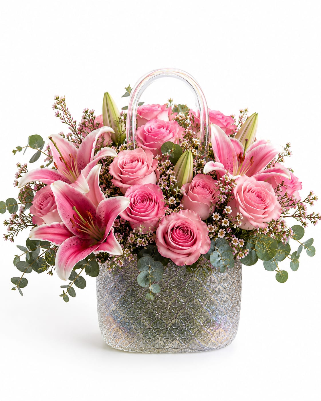 Bloom Purse Collection - Celebrate Mom with elegance and timeless beauty. Our exclusive floral purse arrangements are designed in stunning handbag-style glass vases, filled with premium pink roses, delicate alstroemerias, and lush hydrangeas in white, green, and soft blue tones.  Each design is handcrafted to create a luxurious floral statement perfect for Mother’s Day, birthdays, or simply to remind someone how loved they are. A sophisticated gift that combines fashion-inspired elegance with the beauty of fresh flowers.   Includes: • Premium Roses • Alstroemerias • Hydrangeas • Elegant Purse Vase • Fresh Greenery Accents  Perfect for gifting the most special women in your life.