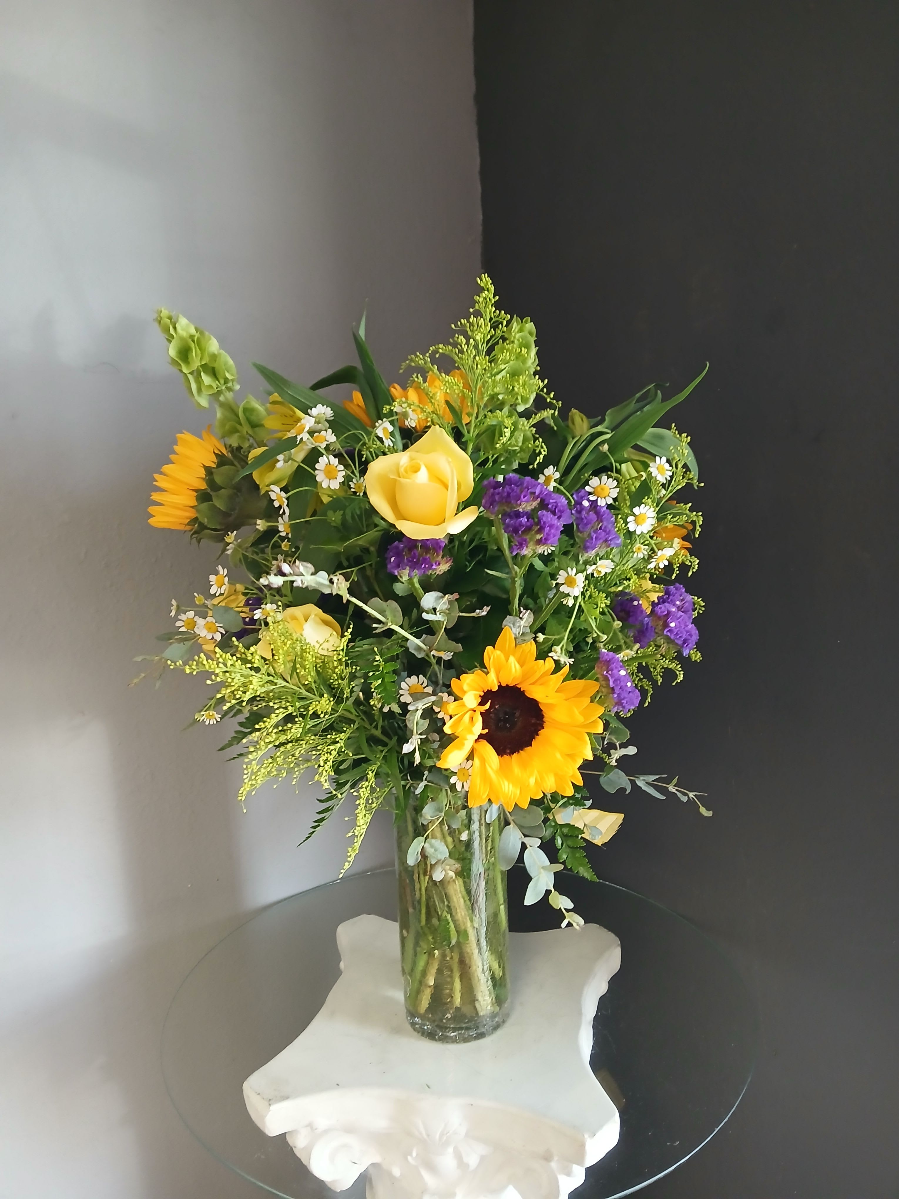 #717 Designer's Choice Vase Arrangement - This beautiful flower arrangement of fresh mixed seasonal blooms is made by local designers in the heart of Orange California. Hand crafted and perfect for every occasion, from birthdays and new babies to sympathy and just because. The best choice to show you are thinking of that special someone. Can be sent as a local delivery or in-store pickup. This is an original, one of a kind arrangement. Order now before it's too late!  UPGRADES: All upgrades are applied at the designer’s discretion and fulfilled to value using the freshest seasonal and/or premium flowers available. Container upgrades may be included when possible; otherwise, value is reflected in the floral selection while maintaining the original design style. 