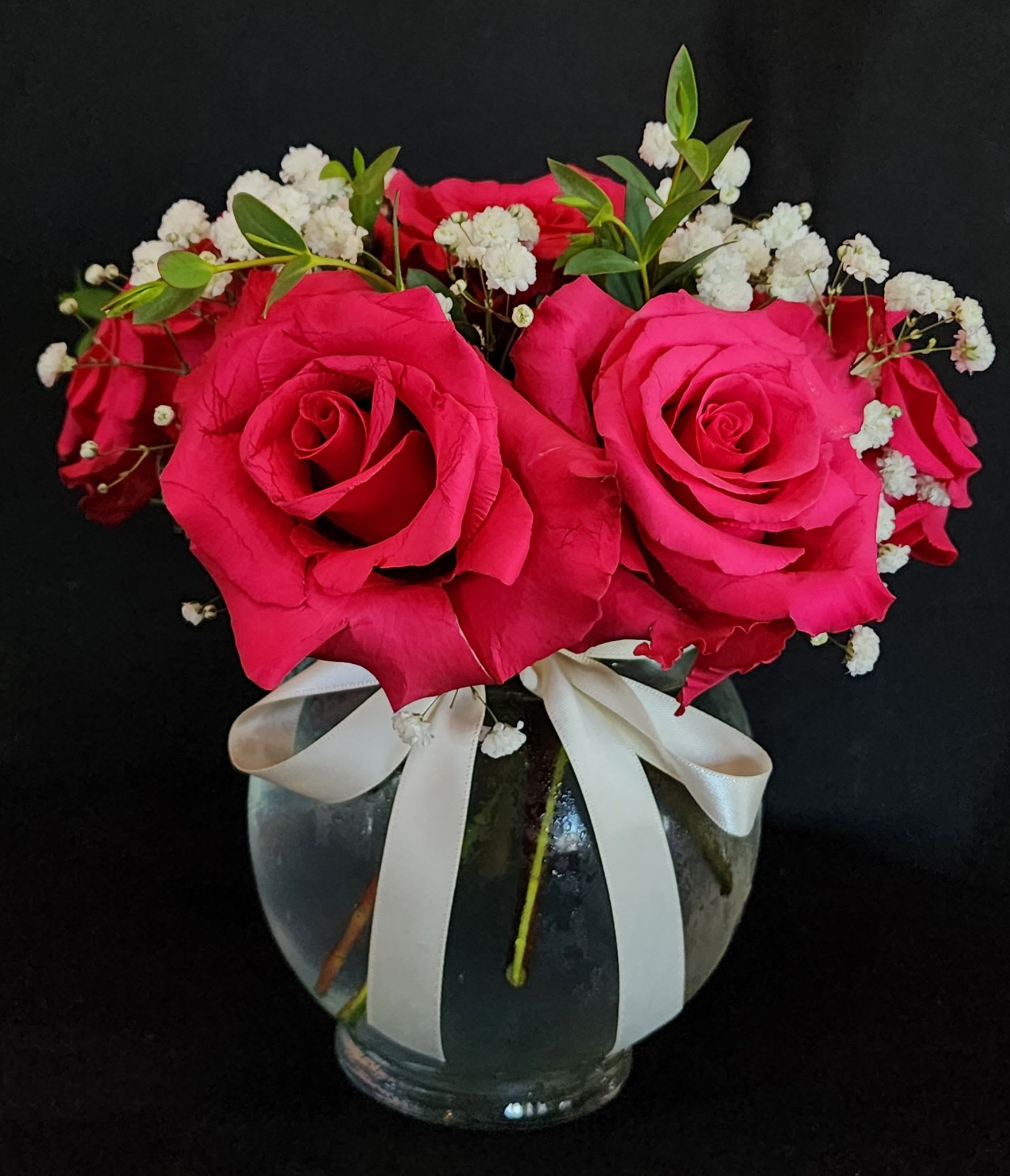 Small roses by the dozen (with greens and fillers) - Half a dozen, 1 dozen, 2 dozen roses with greens and fillers (babies breath).  Half a dozen roses comes in a small 5" glass bowl.  1 and 2 dozen roses come in a 8" glass vase.