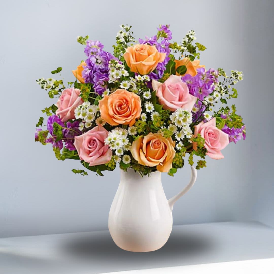 Pitcher Full of Roses -  A fresh bouquet of roses, stock, Monte casino, bupleurum, and salal is Arranged by our expert florists in a striking, food-safe ceramic pitcher. SUBSTITUTION OF COLOR PICTHER WILL BE MADE. AVAILABLE COLORS: White with purple flower pattern, blue or pink,