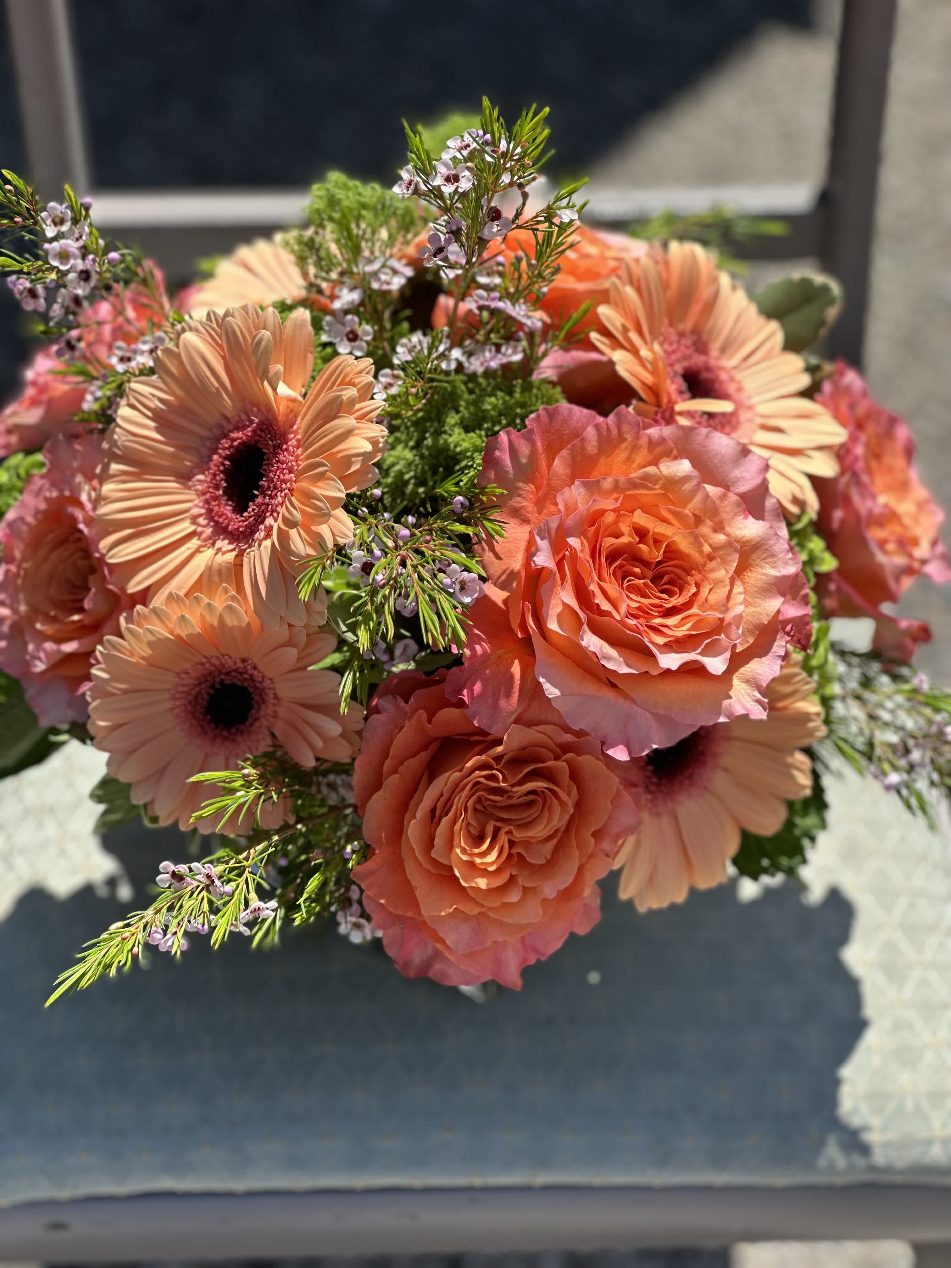 Bouquet of peach gerbera daisies and coral roses
