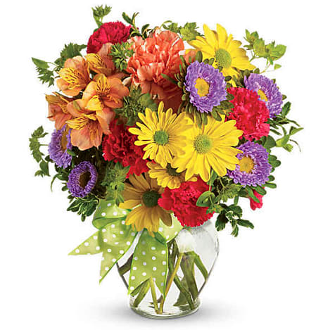 Make a Wish - Make someone's dreams come true with this extra-special, premium version of our Make a Wish bouquet, featuring a bigger, brighter bouquet with even more blooms in happy hues of yellow, purple, orange and red! Whatever the occasion, it's an eye-catching display that's sure to make someone's day.  A deluxe mix of fresh yellow, purple, orange and red flowers such as carnations, daisy spray chrysanthemums, Matsumoto asters and alstroemeria is delivered in a glass vase accented with a decorative ribbon. Orientation: All-Around 