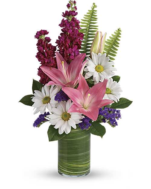 Playful Daisy Bouquet - Full of whimsy, this playful bouquet of pink roses, white daisies, pink lilies and fuchsia stock is a fun surprise for any special occasion! It's wrapped in a ti leaf in a glass cylinder vase for a modern touch.  Pink asiatic lilies, pink roses, fuchsia stock, white daisy spray chrysanthemums, and raspberry sinuata statice are accented with sword fern, variegated ti leaf, and lemon leaf. Orientation: All-Around 