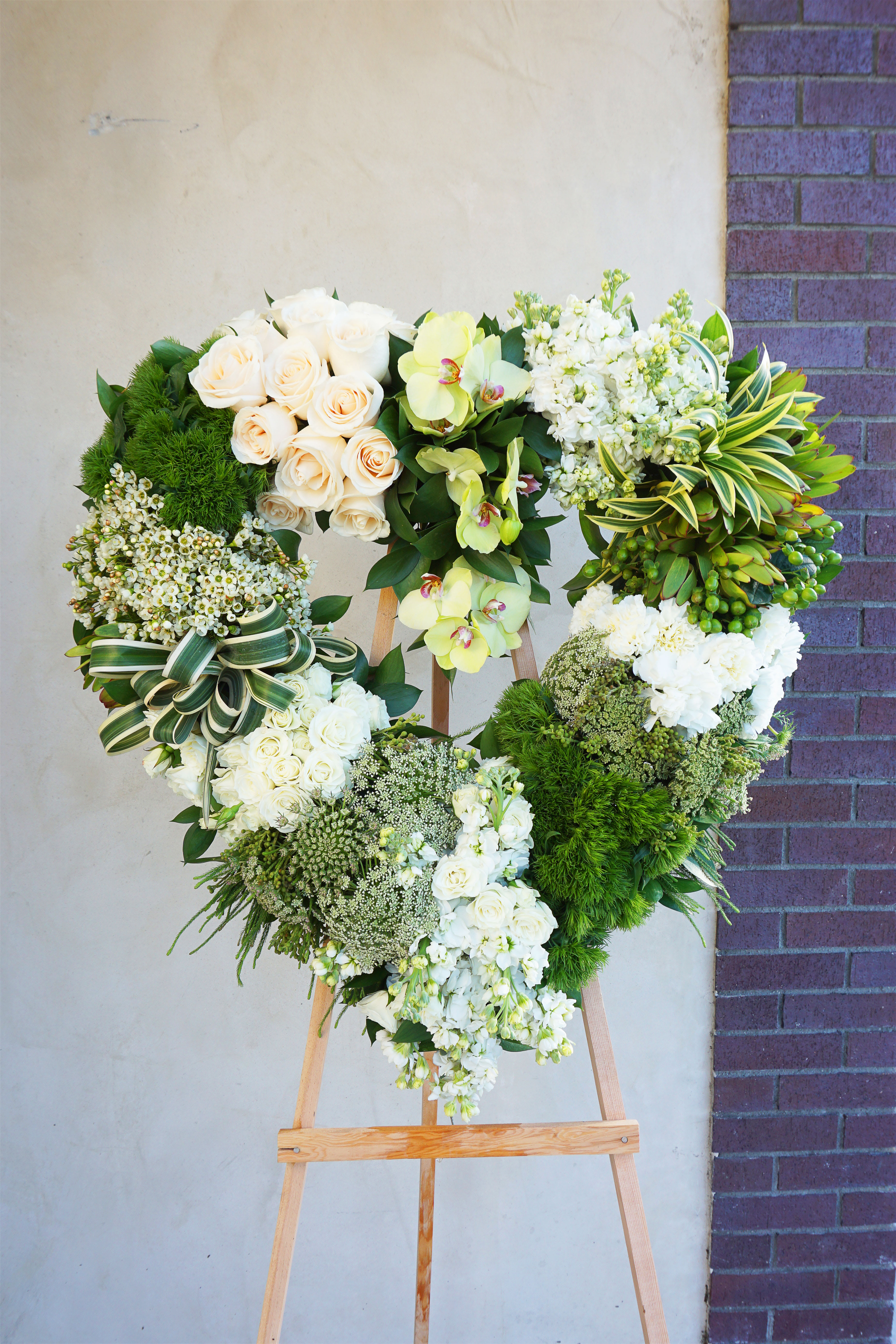 Harmony Heart  - Beautiful tall standing spray. The standing isle is included. Delivery includes setup.
