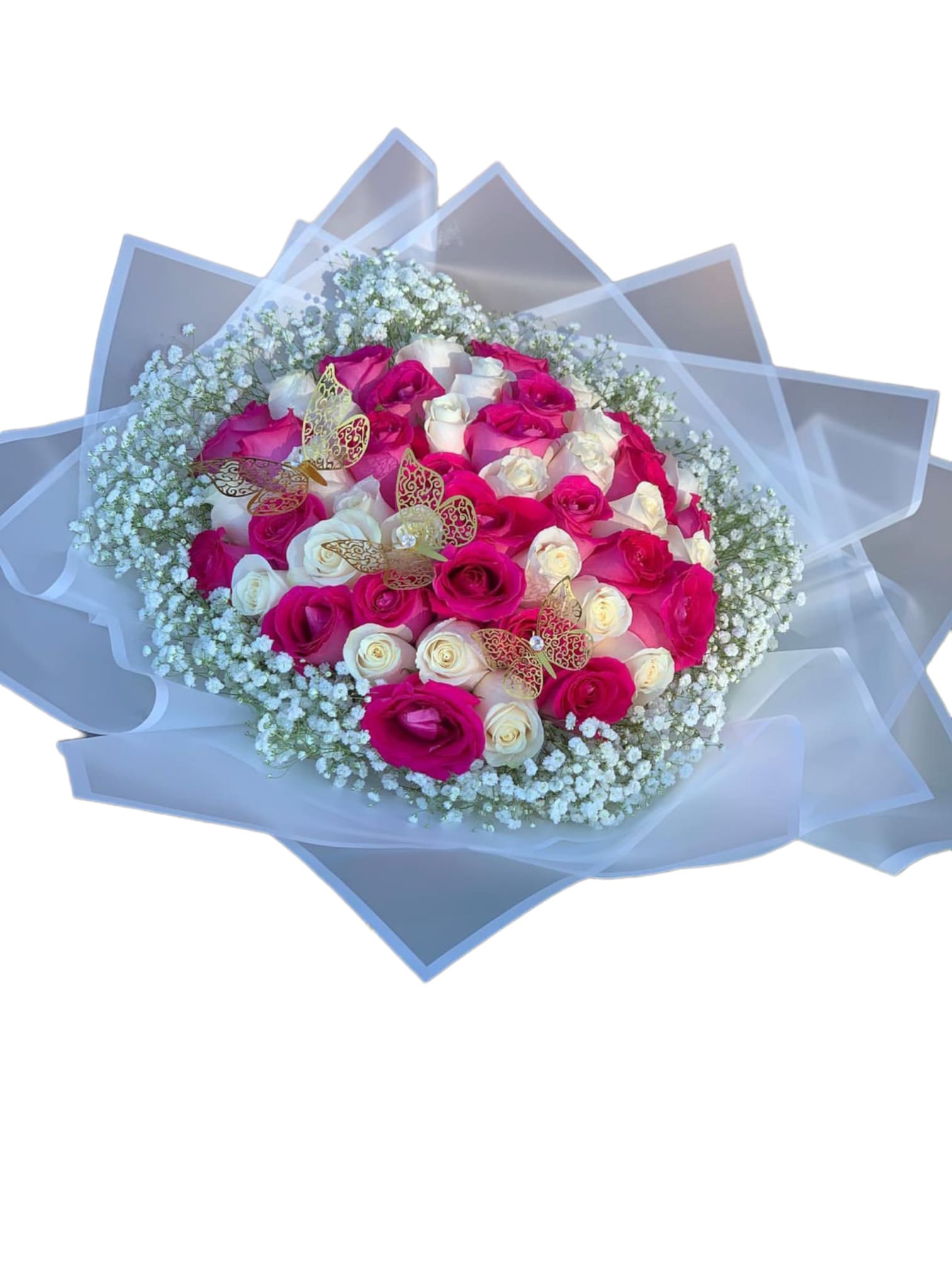 Bouquet of pink and white roses with baby’s breath and butterfly accents