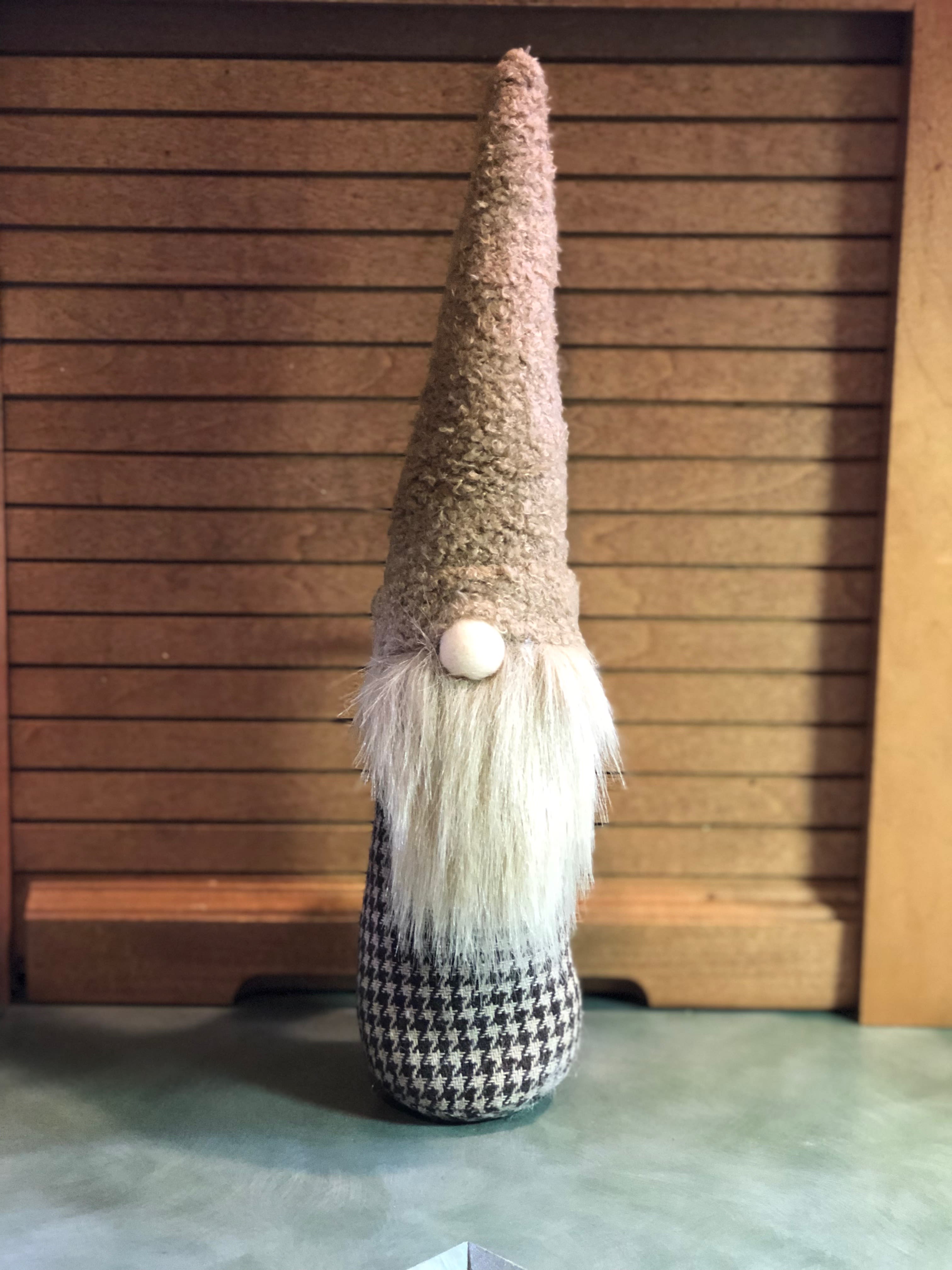 Tall decorative gnome figurine with a long white beard and pointed hat