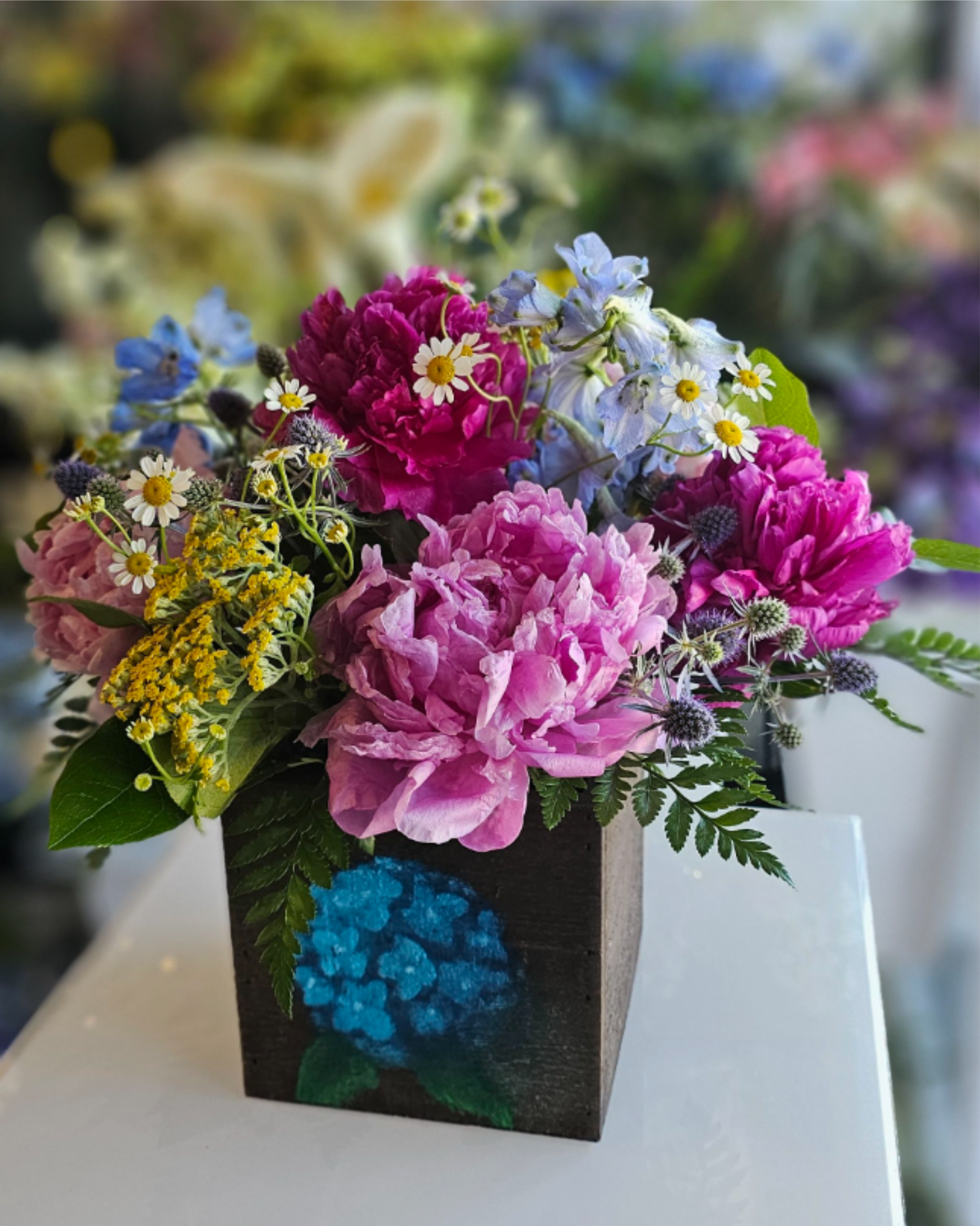 Ladies Night Out!!! Paint, Wine, Design - Join us Thurs. 6/25 at 6pm for Ladies Night Out! Paint. Wine. Design.  Bring your drinks + snacks, we'll provide the rest!  Paint a 5"x5" wooden box, then we'll create a floral design w/ peonies + locally grown flowers in the box.   All supplies included!