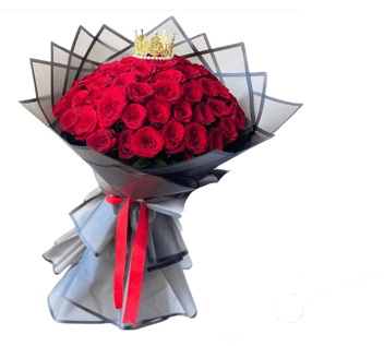 Bouquet of red roses wrapped in black paper with a red ribbon
