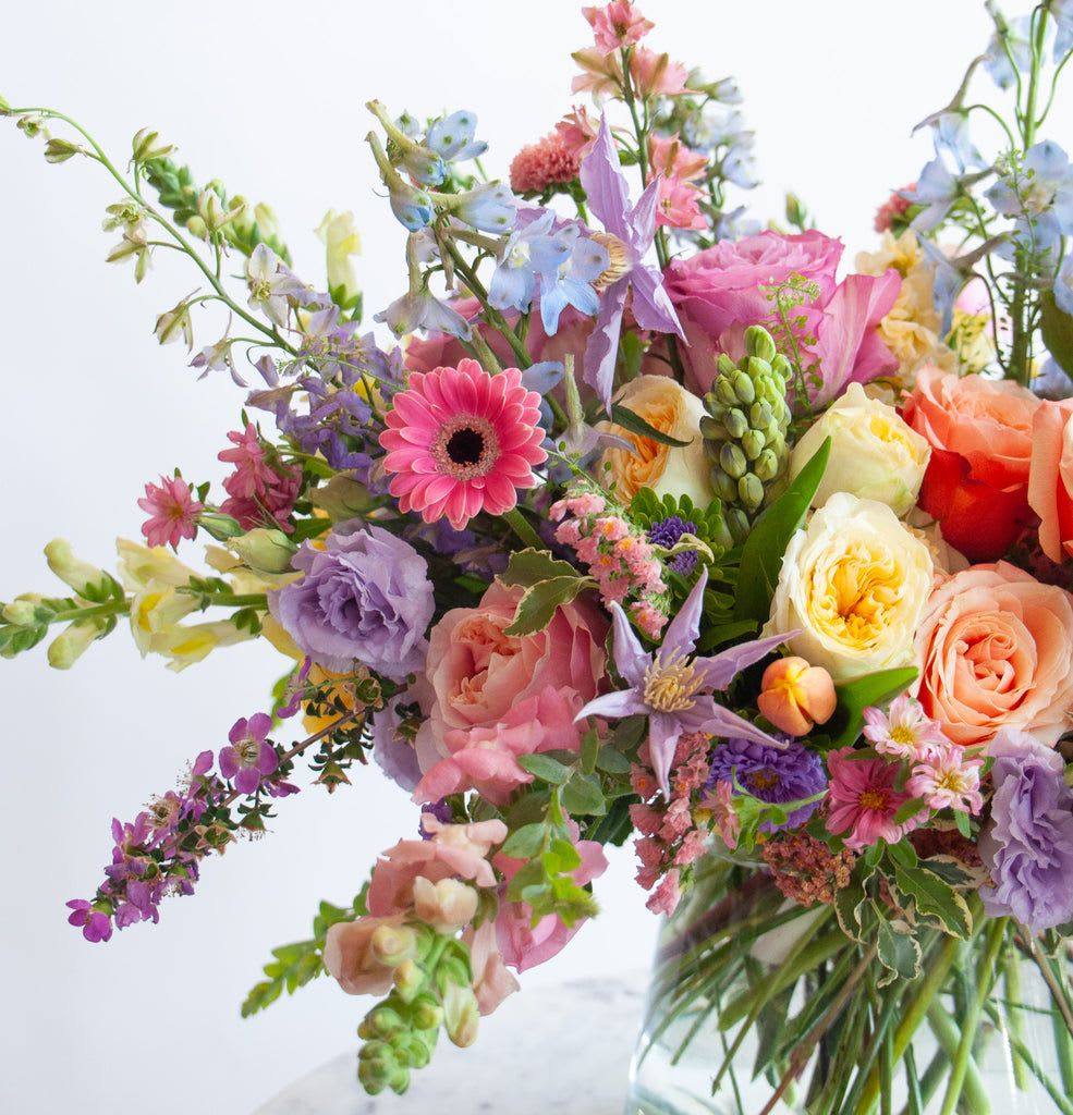 Spring Vased Designer's Choice Arrangement - $150 Value (Online Special Only) - Let our designer create a one-of-a-kind arrangement using the freshest flowers of the season. Each Designer’s Choice arrangement is thoughtfully crafted based on daily availability and the value selected. The photo shown is for style inspiration only and does not represent the exact arrangement you will receive. Flower types, colors, and container will vary, and no specific flowers or design can be guaranteed.