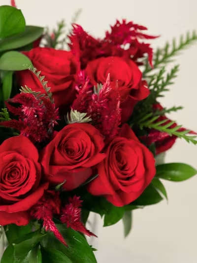 Designer's Choice Romance Short - A lush, intimate expression of passion, our Designer’s Choice Romance Short Arrangement is designed in a rich palette of jewel‑tone blooms. Deep purples, velvety burgundies, and romantic reds come together in a curated mix of premium seasonal flowers, each chosen fresh by our designer for depth, texture, and emotion.  Arranged in a low, modern silhouette, this piece feels full, warm, and irresistibly romantic — a perfect blend of moody elegance and heartfelt charm. Ideal for anniversaries, love notes, or adding a touch of dramatic romance to any cozy space.