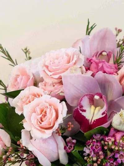 Designer's Choice Pastel Short - A gentle, airy expression of beauty, our Designer’s Choice Pastel Short Arrangement is designed in a serene palette of soft blush, peach, lavender, buttercream, and powder blue. Each piece is thoughtfully composed with premium seasonal blooms selected fresh by our designer for texture, fullness, and a delicate, romantic presence.  Arranged in a low, modern silhouette, this design feels light, graceful, and effortlessly elegant. Its compact profile makes it ideal for gifting, brightening a bedside table or desk, or adding a refined whisper of pastel charm to any intimate space.