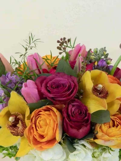 Designer's Choice Short Bright - A vibrant, uplifting expression of color and movement, our Designer’s Choice Bright Short Arrangement is designed in a lively palette of bold, cheerful blooms. Sunlit yellows, vivid oranges, hot pinks, bright corals, and energetic greens come together in a curated mix of premium seasonal flowers chosen fresh by our designer for height, texture, and joyful presence.  Arranged in a sculptural silhouette, that design radiates warmth and optimism — full of dynamic lines, rich color, and modern elegance. Perfect for celebrations, birthdays, thank‑yous, or adding a striking burst of brightness to any space.