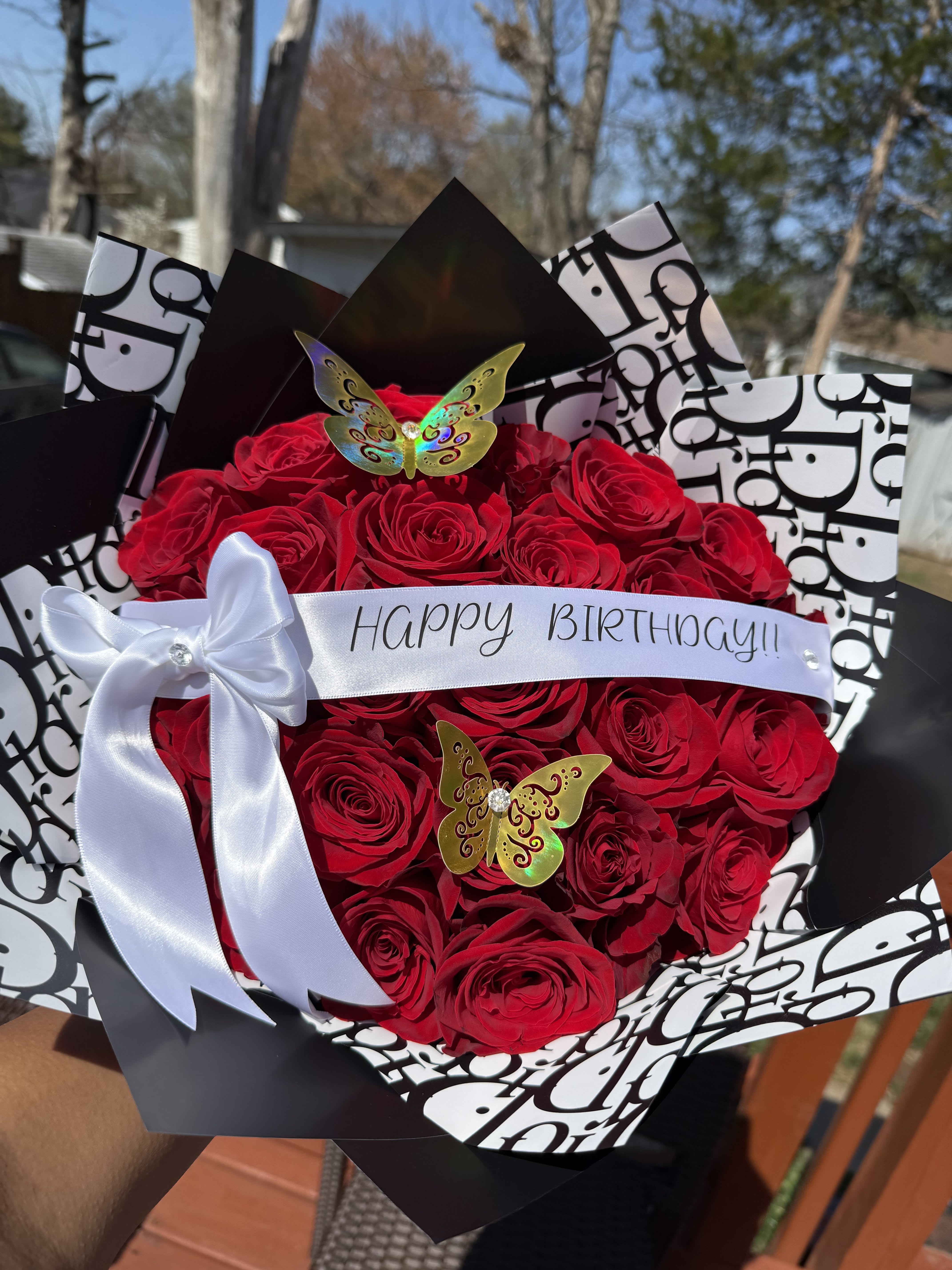 Red rose bouquet with a Happy Birthday ribbon and white bow