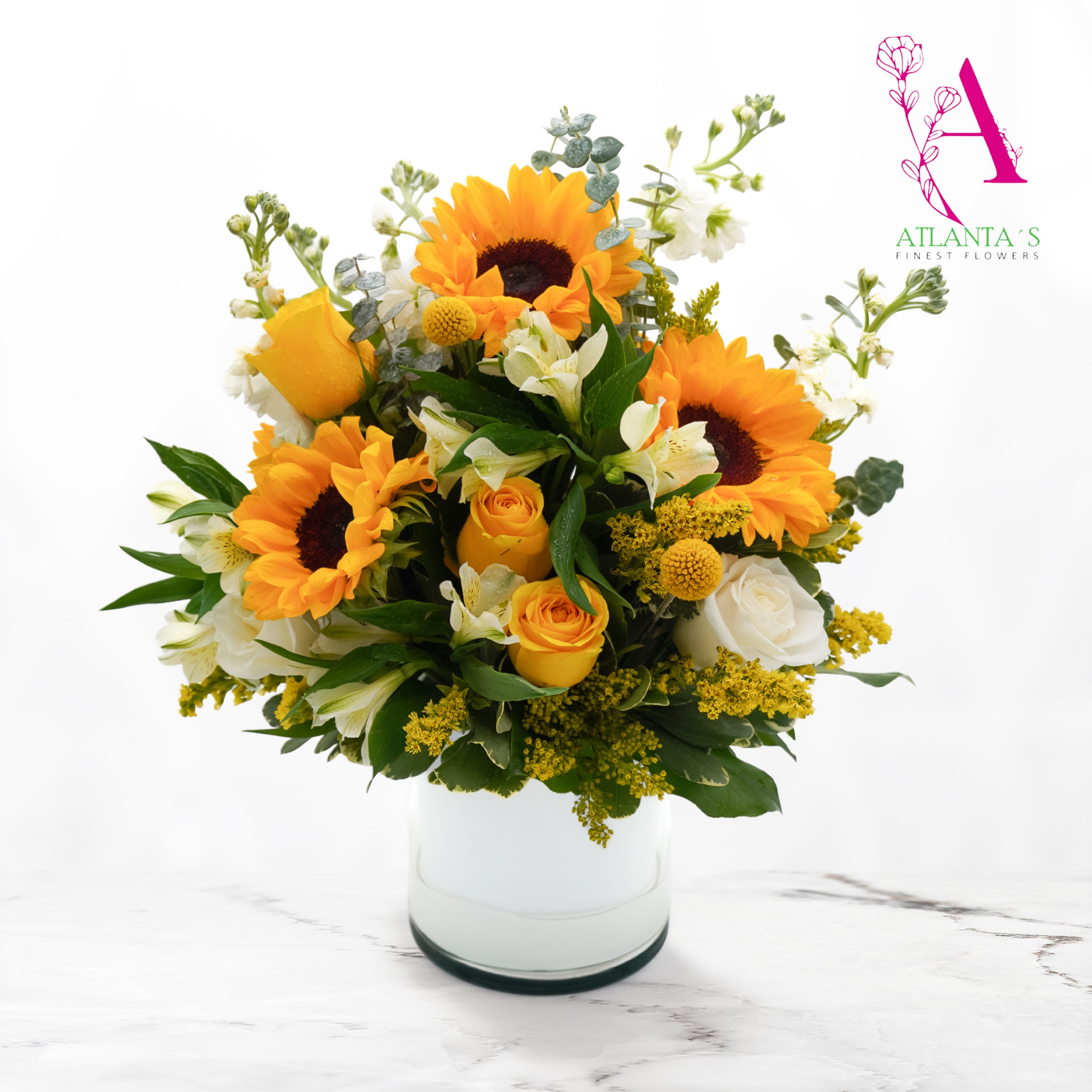 Warm Sunflowers - Includes sunflowers, white stock, yellow aster, alstroemeria, and yellow/white roses.  Vase Size: 6x6