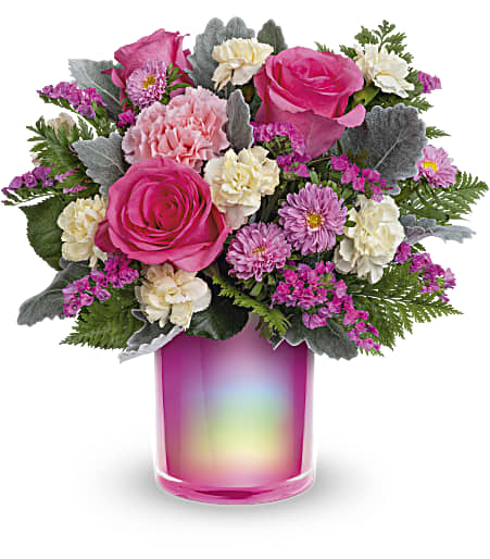 Pink roses and carnations in a rainbow glass vase