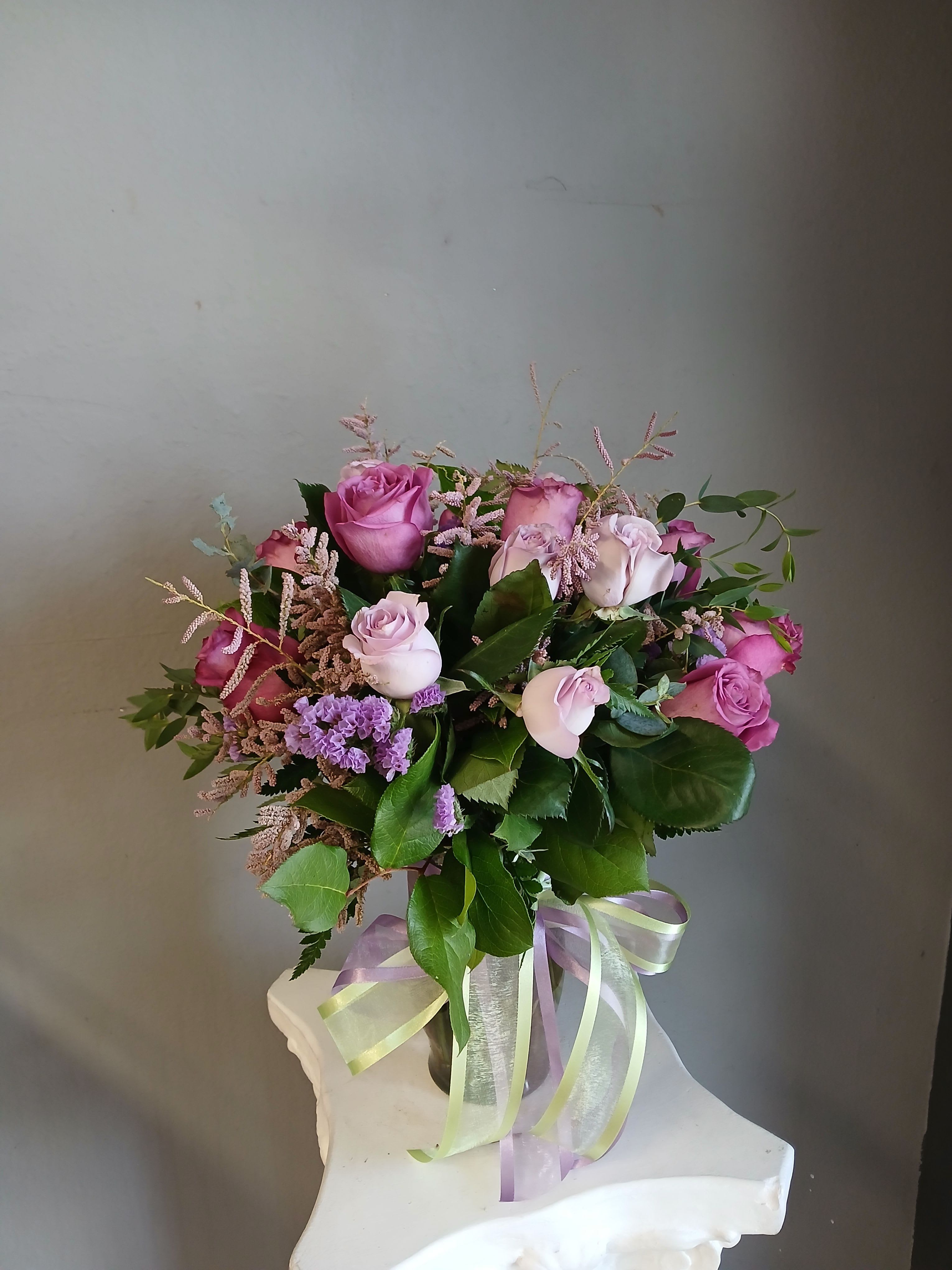 *Elevated* Rose Special In a Vase  - This fan favorite rose special includes mixed colored (excluding red) local 40 centimeter local roses in a vase. A beautiful way to let someone know you are thinking of them, perfect for any occasion. The life expectancy of this beautiful arrangement is approximately 3-5 days. May be more or less depending on how they are cared for. Color of rose, vase, filler, greens and ribbon will vary, and will not be the same as the picture show.