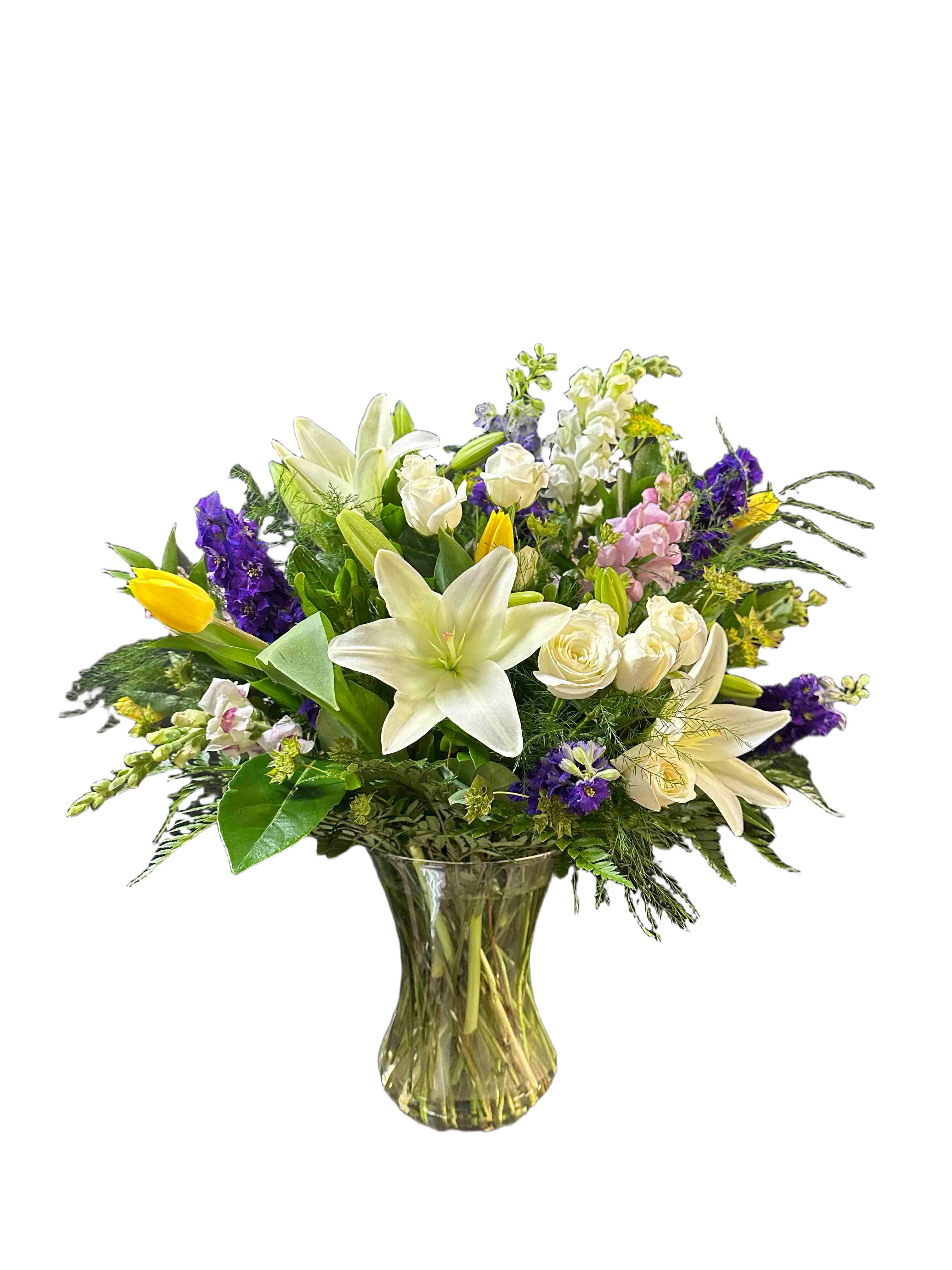 Passion Bouquet - Large, garden-style bouquet of tulips, white lilies and roses with purple, yellow, and pink accents in clear vase.