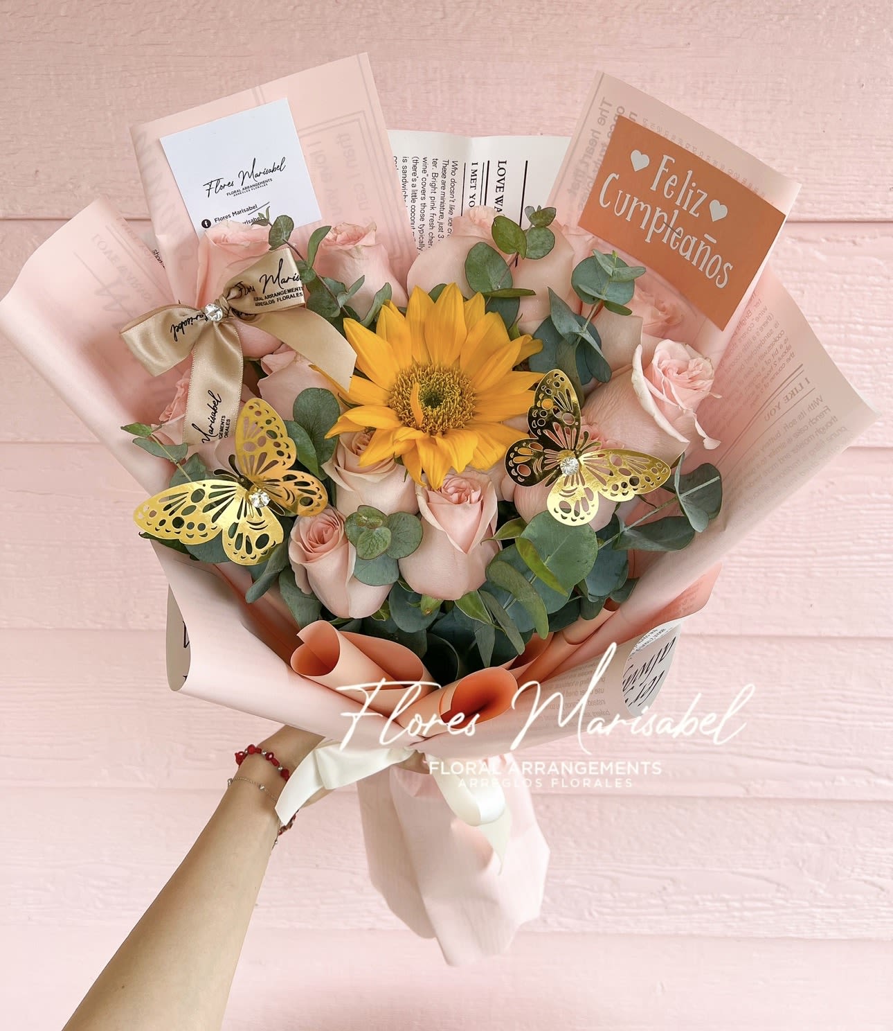 Con Amor pink  - Dozen pink roses with 1 sunflower and filler. (Does not include butterflies or sign) 