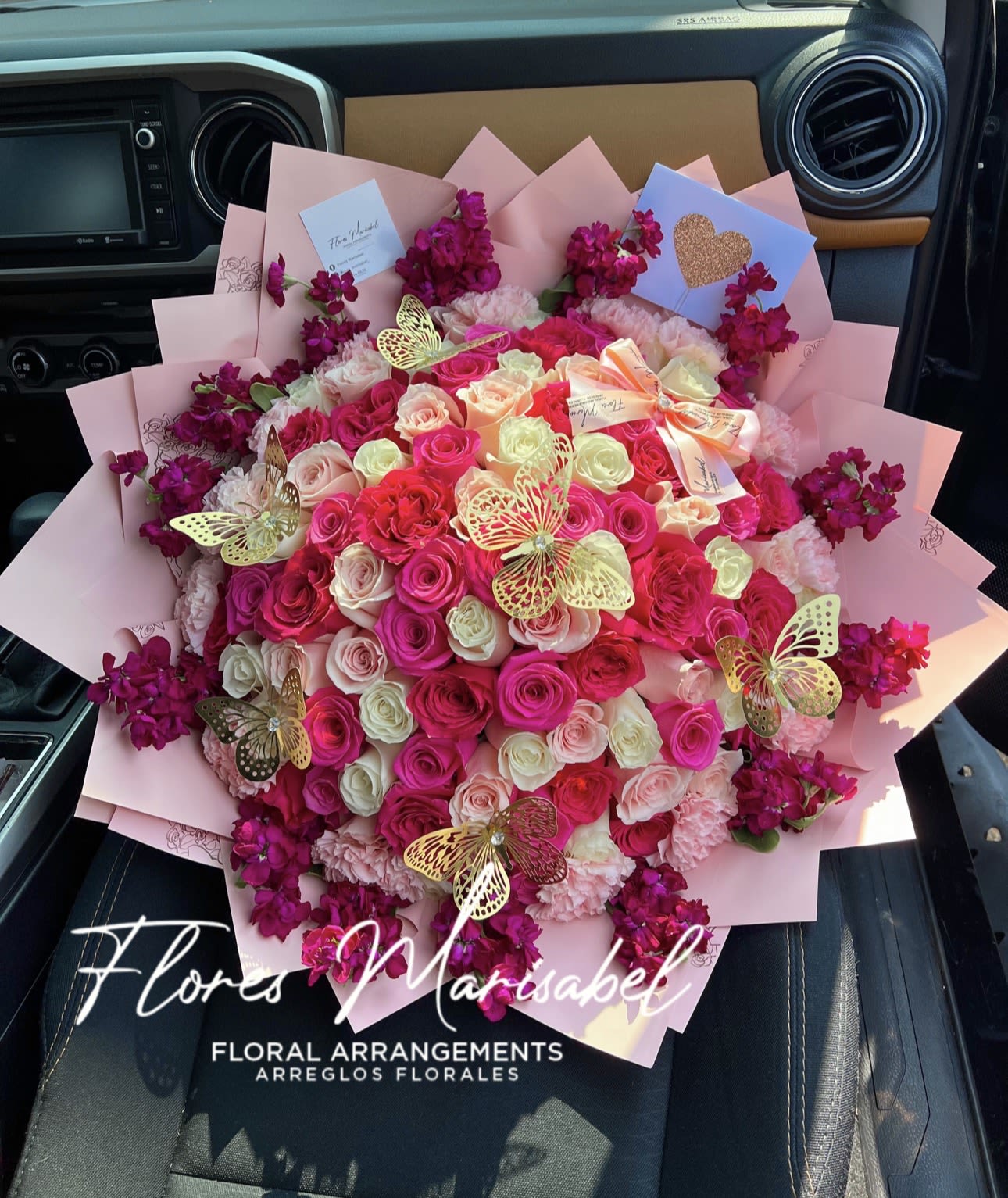 Valentina bouquet  - 100 mixed roses, flower rim, and 6 butterflies. Pink theme. (Does not include card.)