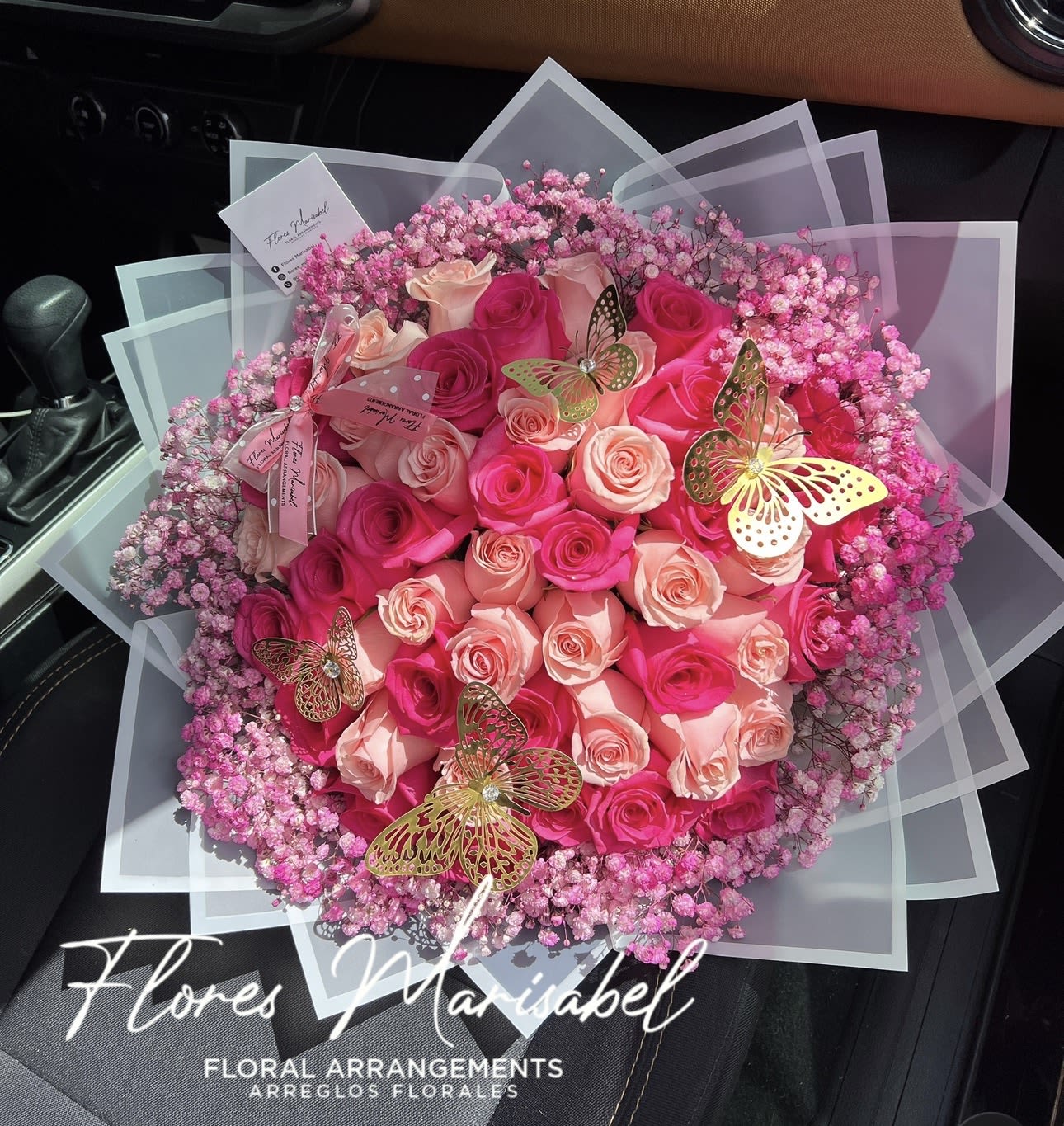 Pretty in pink  - 50 pink roses with pink babies breath. (Butterflies not included) 