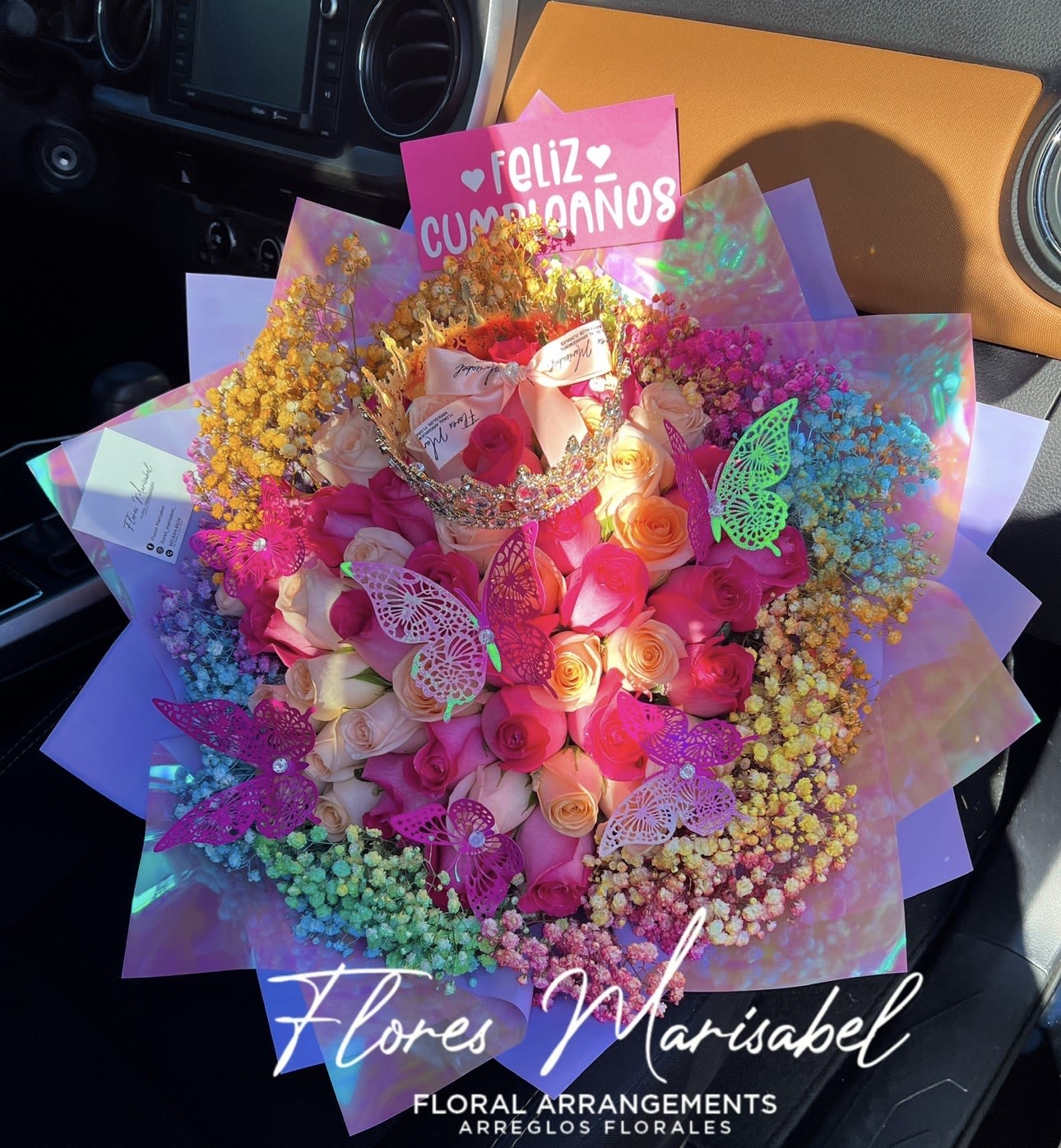 Ramo Culichi - 50 mixed roses with colorful babies breath rim. Purple wrap. (Does not include butterflies, crown or sign)