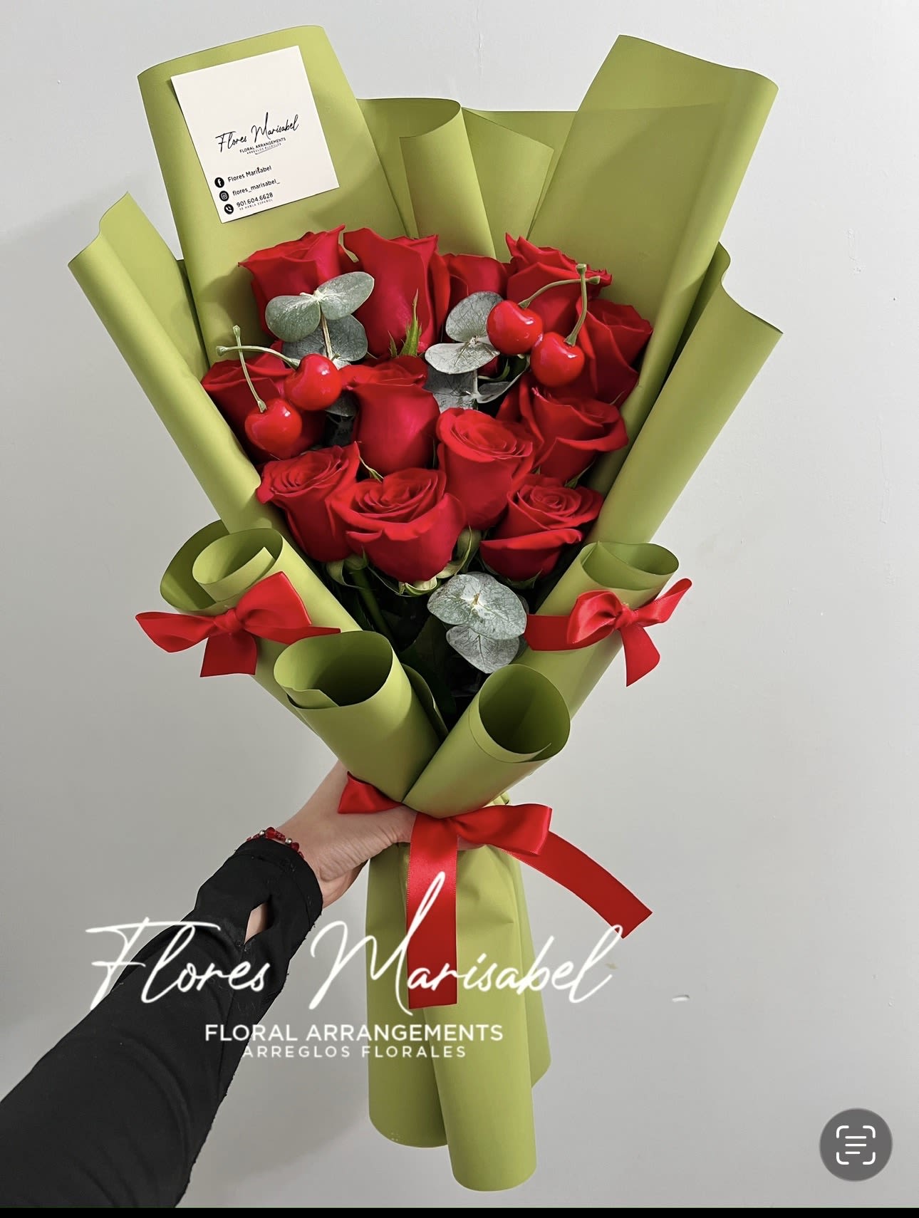 La cherry small - Dozen red roses with filler and cherries. Green paper. 