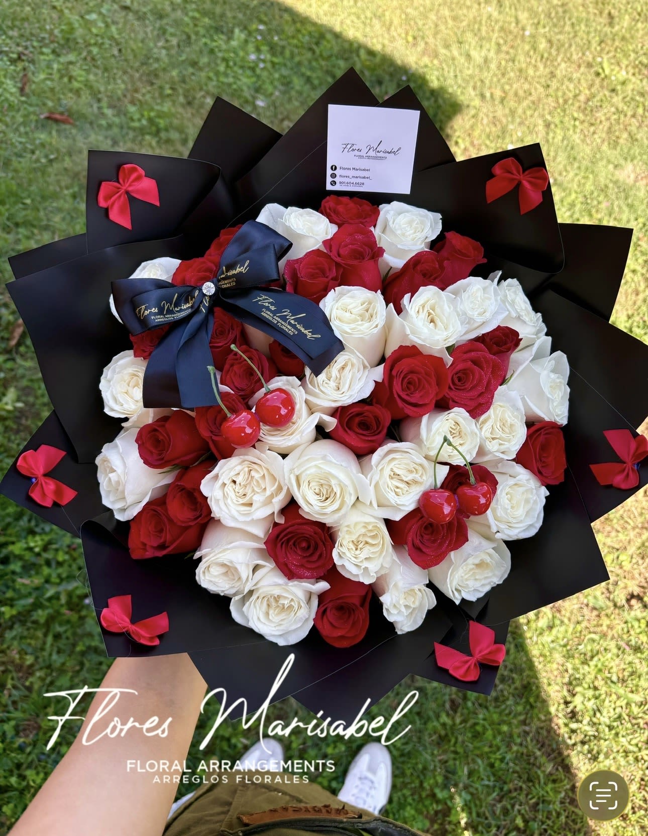 La cherry red and white  - 50 red and white roses. Cherries. Black paper. Bows. 