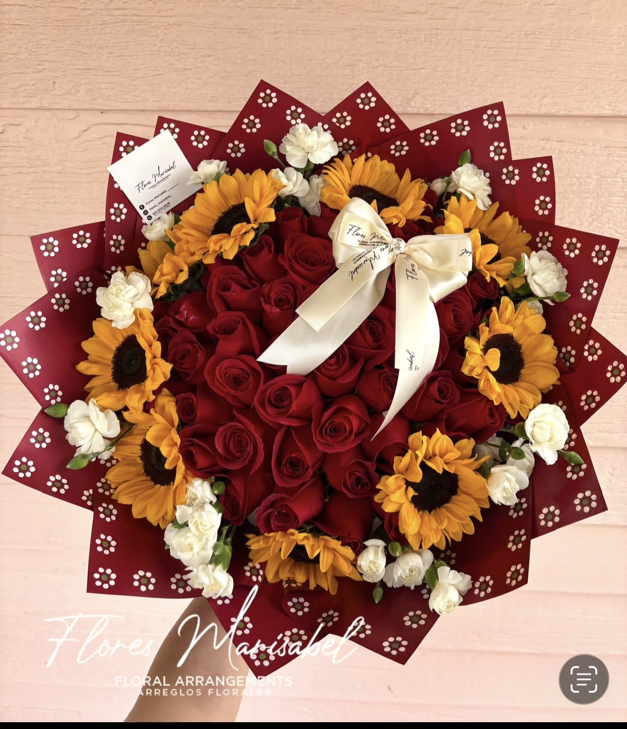 La Tapatia - 50 red roses. Sunflower rim. Filler flowers. Red wrap. 