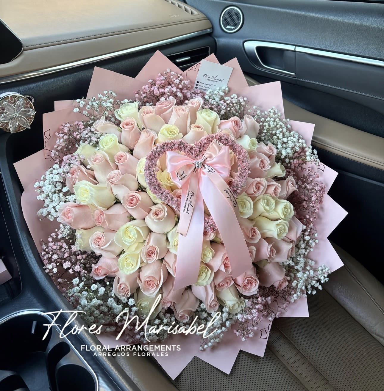 Cupid Love  - 50 pink and white roses. Babies breath rim. With babies breath heart. 
