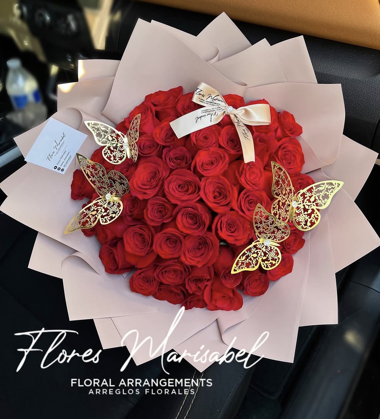 Classic 50 roses - 50 red roses. Nude wrap.   If you want a different paper color put in florist instructions.   (Does not include butterflies) 