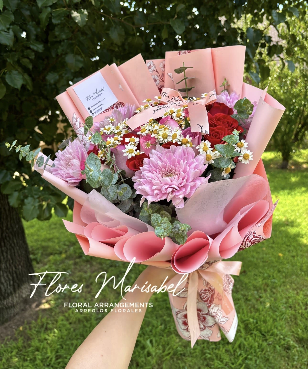 24 rose freestyle  - 24 rose freestyles. Roses and flowers. Flowers and colors will vary. If you want a certain color incorporated please leave in florist instructions and we will do our best to incorporate it. 