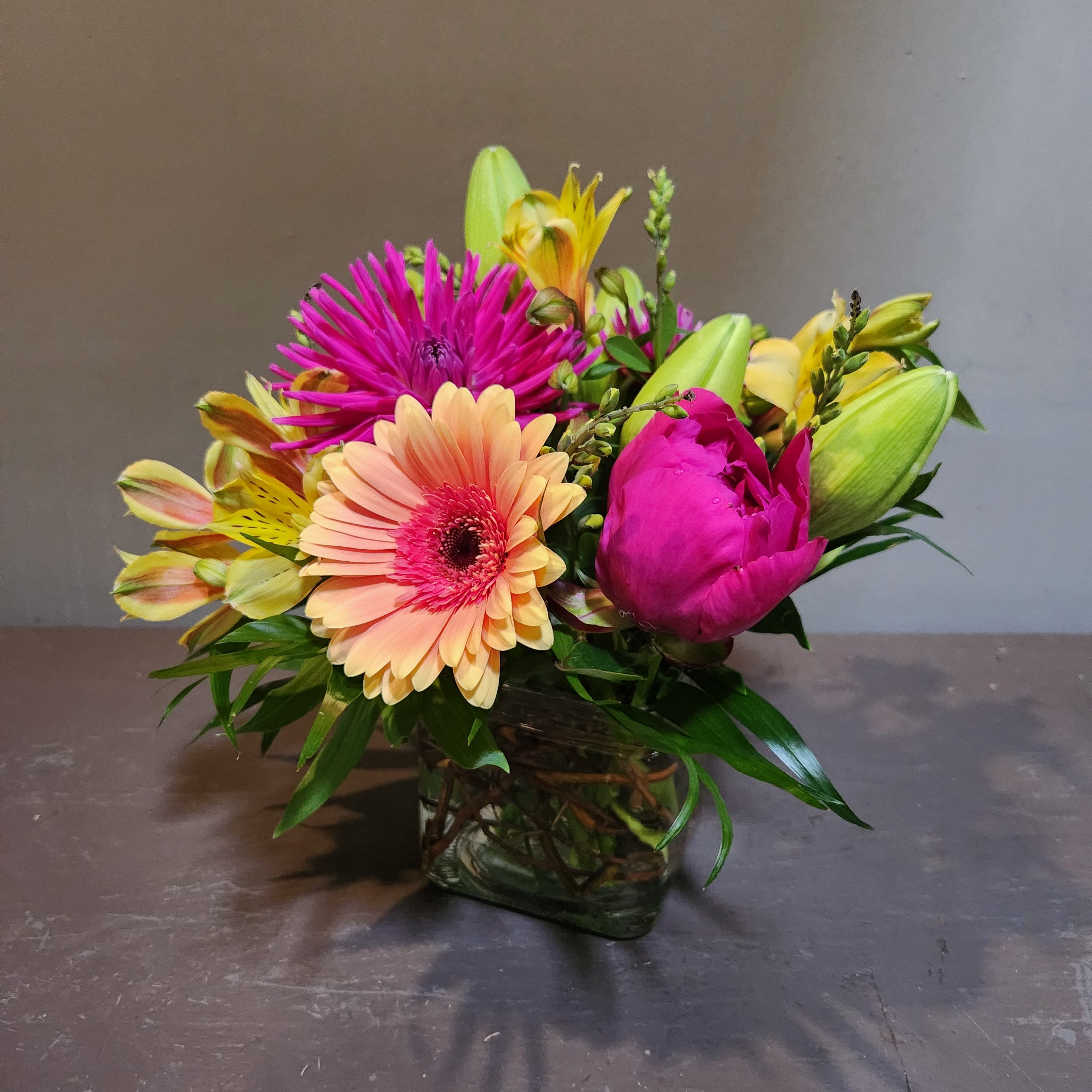 Hot, Hot, Hot - 100% MN Grown! - A chic, modern and vibrant arrangement that is 100% MN Grown! Measures approx. 11"Tx11"W and arrives in a glass vase.