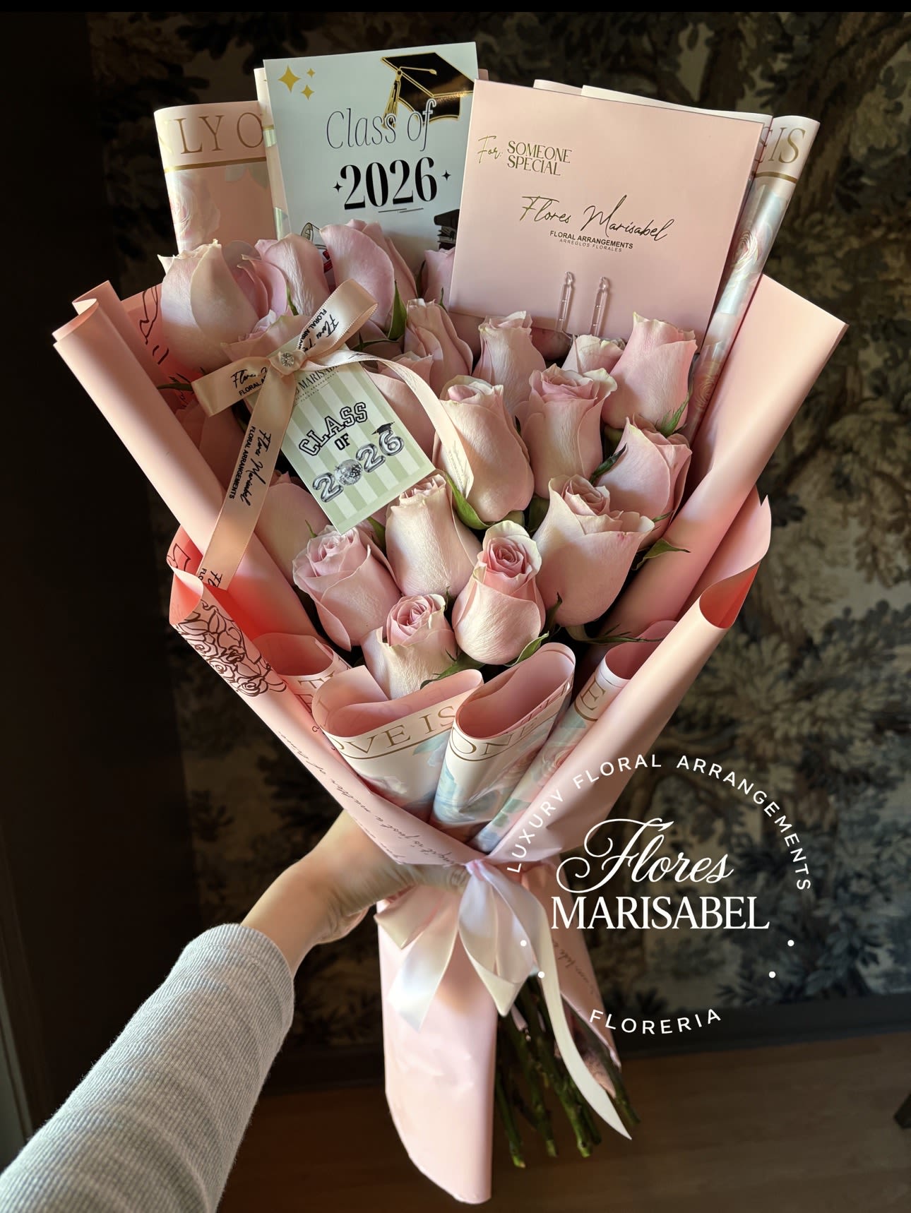 24 pink rose graduation  - 24 pink roses. With class of 2026 sign and hang tag . (Does not include card) 