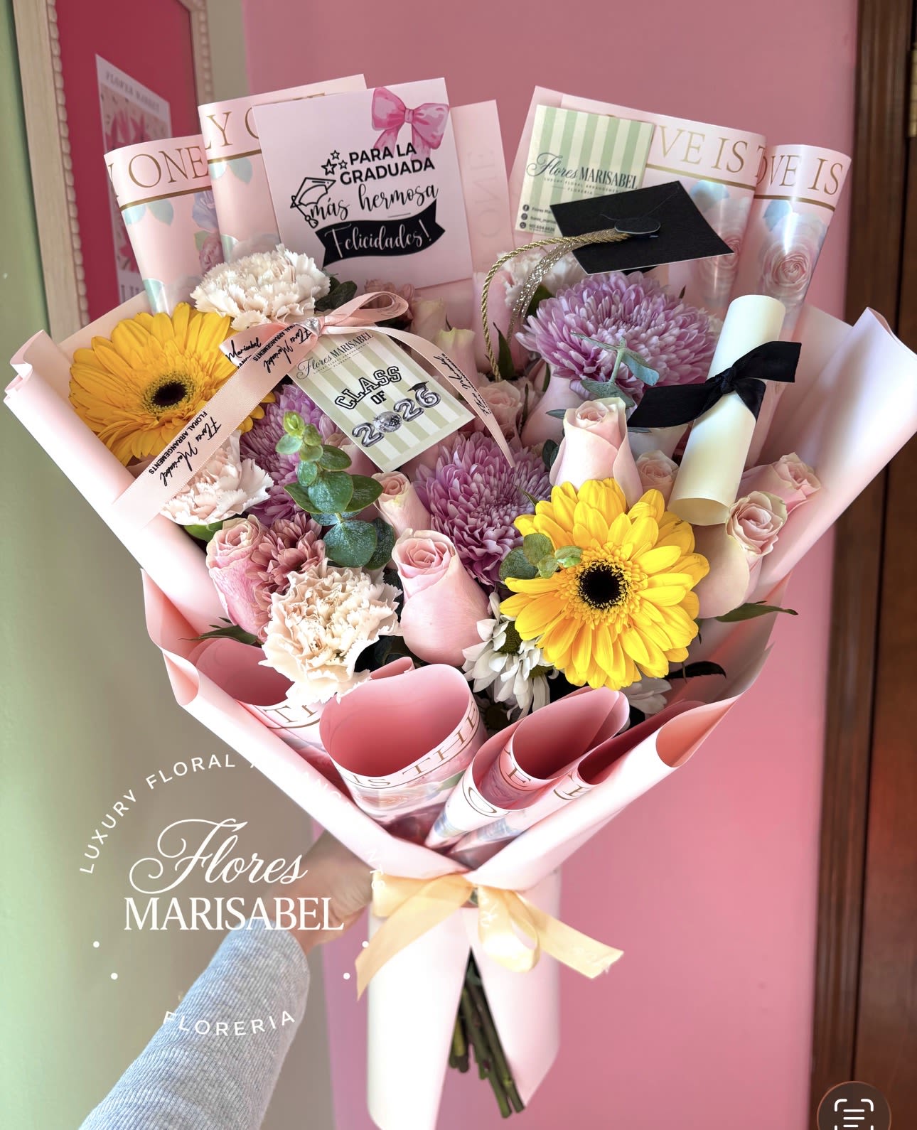 24 rose Freestyle graduation bouquet  - 24 roses and flowers. Includes cap, diploma, and graduation sign. 