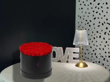 Classic 50 Roses Hat Box - Classic 50 Roses Hat Box is a luxurious floral arrangement featuring fifty fresh, premium roses elegantly arranged in a modern hat box. This design highlights the natural beauty and fullness of roses, creating a rich and balanced composition with a clean, sophisticated look. The structured hat box adds a contemporary touch while keeping the flowers perfectly styled and easy to display. Perfect for romantic occasions, anniversaries, birthdays, or grand gestures, this arrangement makes a bold and elegant statement. Each piece is handcrafted and may vary slightly to ensure the freshest flowers and the highest quality.
