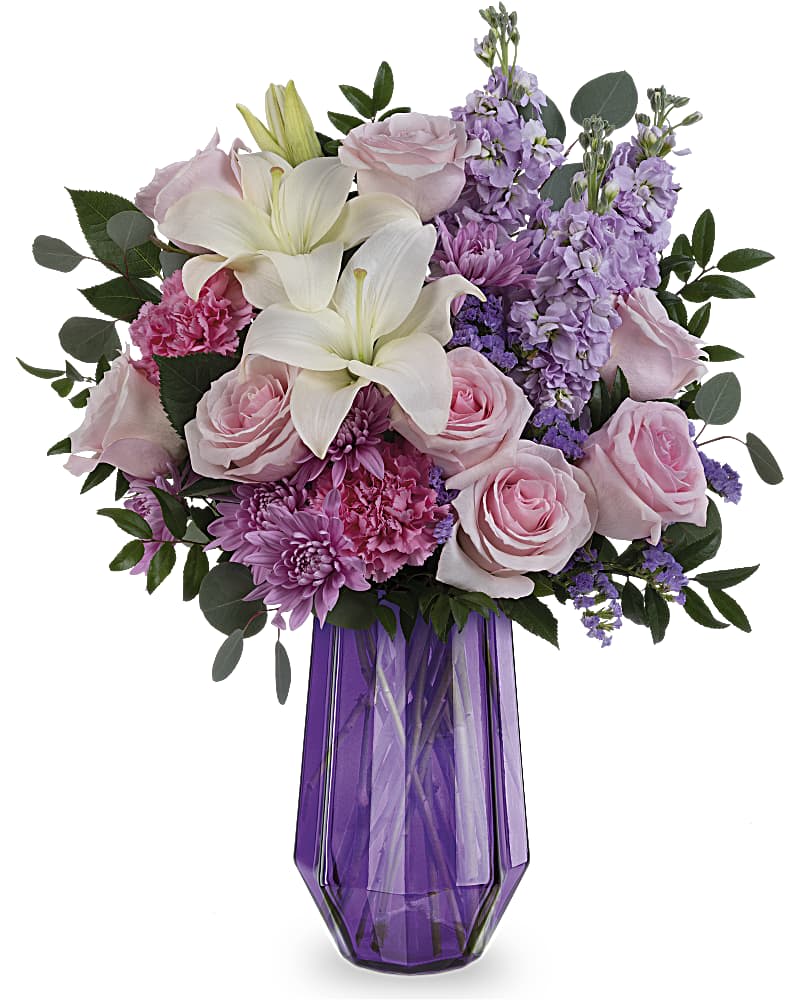 Pink roses and white lilies in a purple glass vase