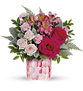 Tender Reflections Bouquet - Hot pink roses, light pink spray roses, miniature pink carnations and dark pink alstroemeria are arranged with pink sinuata statice, leatherleaf fern, huckleberry and dusty miller. Delivered in a pink cylinder. Container may vary 