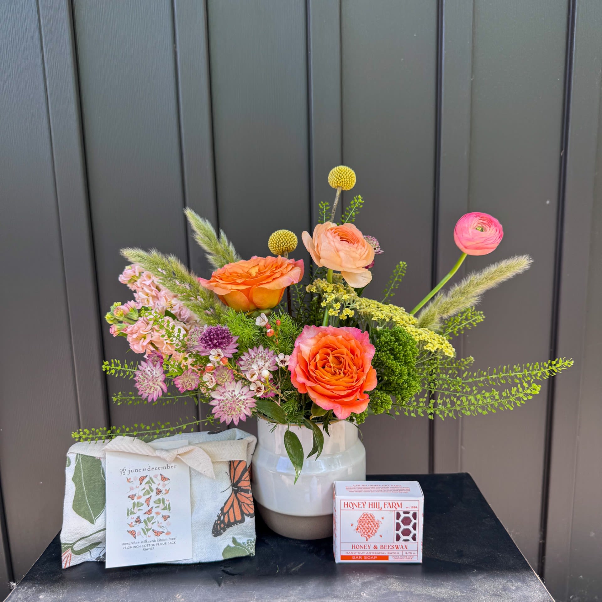Monarch Gift Set - A gift set inspired by our favorite butterfly. This set includes a petite summery floral arrangement, a 100% cotton monarch printed hand towel, and a handmade artisanal soap. Upgrade to deluxe or premium for additional luxe flowers in the arrangement.